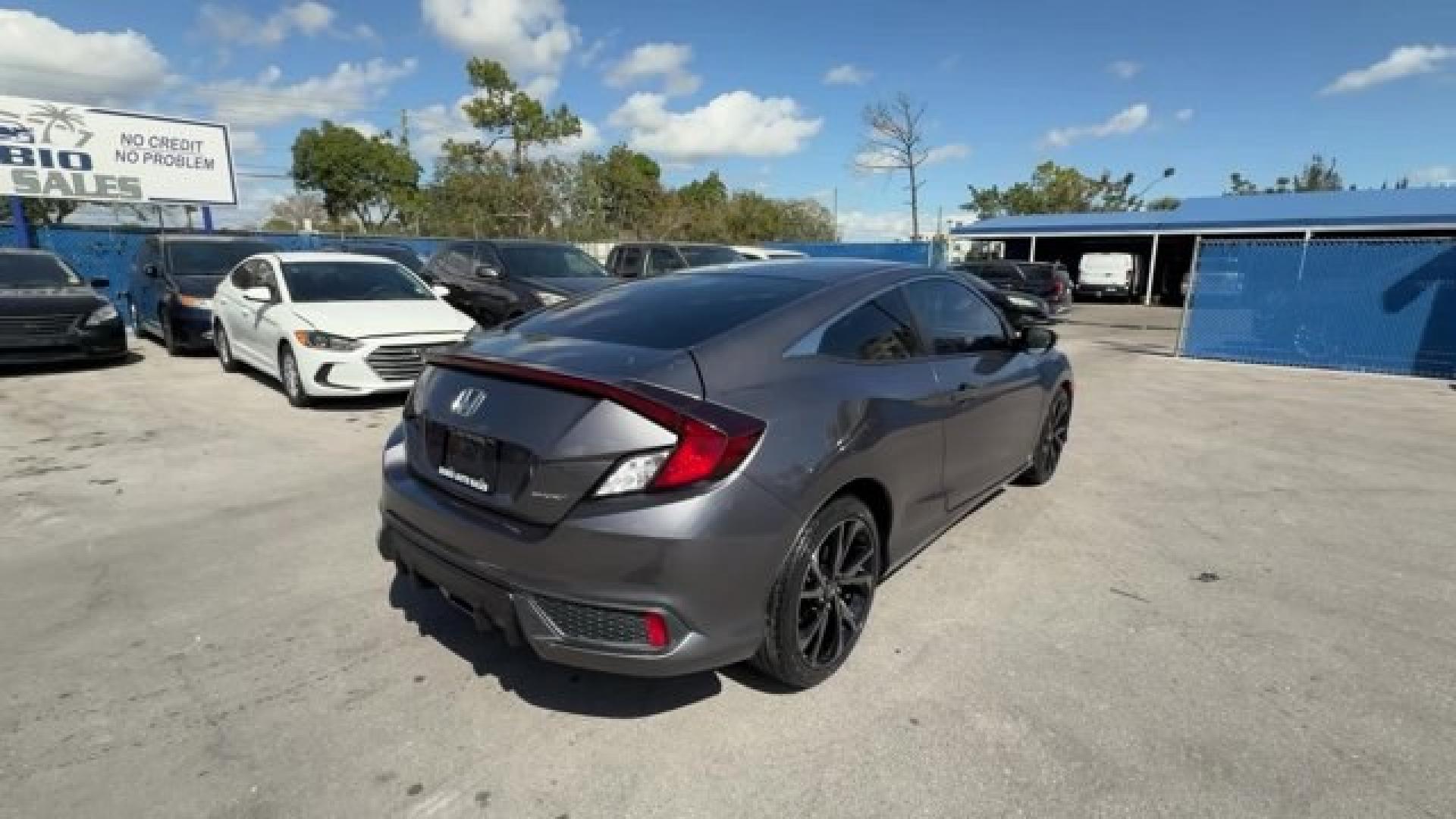 2020 Gray Honda Civic Coupe (2HGFC4B83LH) with an 4 2.0 L engine, Variable transmission, located at 27610 S Dixie Hwy, Homestead, FL, 33032, (305) 749-2348, 25.510241, -80.438301 - Only 32,352 Miles! Scores 36 Highway MPG and 29 City MPG! This Honda Civic Coupe boasts a Regular Unleaded I-4 2.0 L/122 engine powering this Variable transmission. Window Grid Antenna, Wheels: 18 Alloy w/Gloss Black Inserts, VSA Electronic Stability Control (ESC).*This Honda Civic Coupe Comes Equip - Photo#4