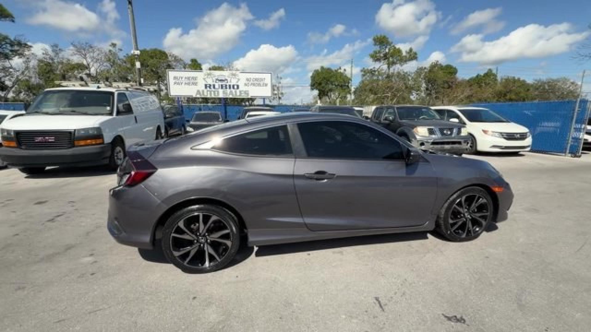 2020 Gray Honda Civic Coupe (2HGFC4B83LH) with an 4 2.0 L engine, Variable transmission, located at 27610 S Dixie Hwy, Homestead, FL, 33032, (305) 749-2348, 25.510241, -80.438301 - Only 32,352 Miles! Scores 36 Highway MPG and 29 City MPG! This Honda Civic Coupe boasts a Regular Unleaded I-4 2.0 L/122 engine powering this Variable transmission. Window Grid Antenna, Wheels: 18 Alloy w/Gloss Black Inserts, VSA Electronic Stability Control (ESC).*This Honda Civic Coupe Comes Equip - Photo#5
