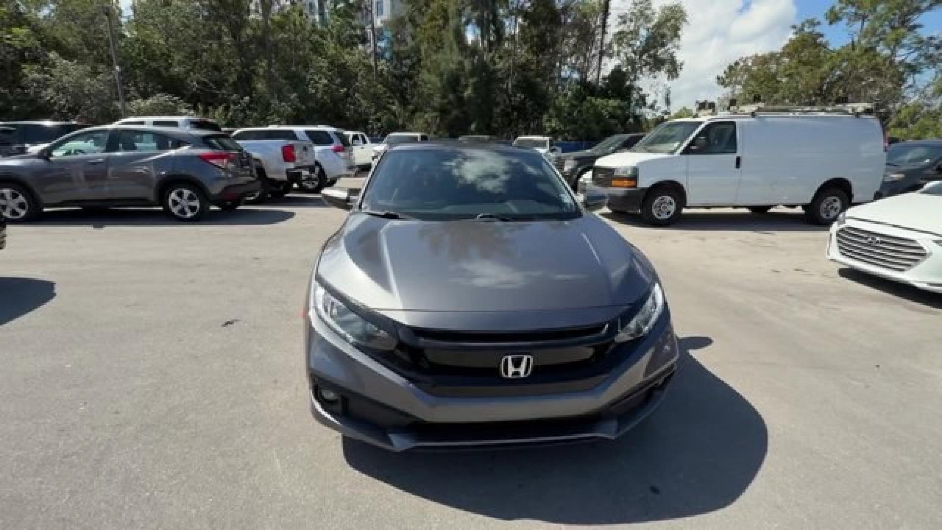 2020 Gray Honda Civic Coupe (2HGFC4B83LH) with an 4 2.0 L engine, Variable transmission, located at 27610 S Dixie Hwy, Homestead, FL, 33032, (305) 749-2348, 25.510241, -80.438301 - Only 32,352 Miles! Scores 36 Highway MPG and 29 City MPG! This Honda Civic Coupe boasts a Regular Unleaded I-4 2.0 L/122 engine powering this Variable transmission. Window Grid Antenna, Wheels: 18 Alloy w/Gloss Black Inserts, VSA Electronic Stability Control (ESC).*This Honda Civic Coupe Comes Equip - Photo#7
