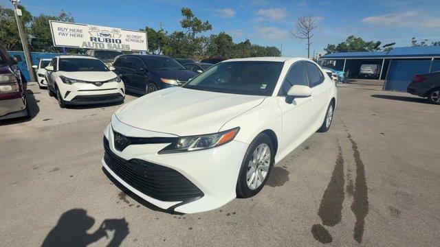 2020 White Toyota Camry (4T1C11AK3LU) with an 4 2.5 L engine, Automatic transmission, located at 27610 S Dixie Hwy, Homestead, FL, 33032, (305) 749-2348, 25.510241, -80.438301 - Boasts 39 Highway MPG and 28 City MPG! This Toyota Camry boasts a Regular Unleaded I-4 2.5 L/152 engine powering this Automatic transmission. Window Grid And Roof Mount Antenna, Variable Intermittent Wipers, Valet Function.* This Toyota Camry Features the Following Options *Urethane Gear Shifter Mat - Photo#0
