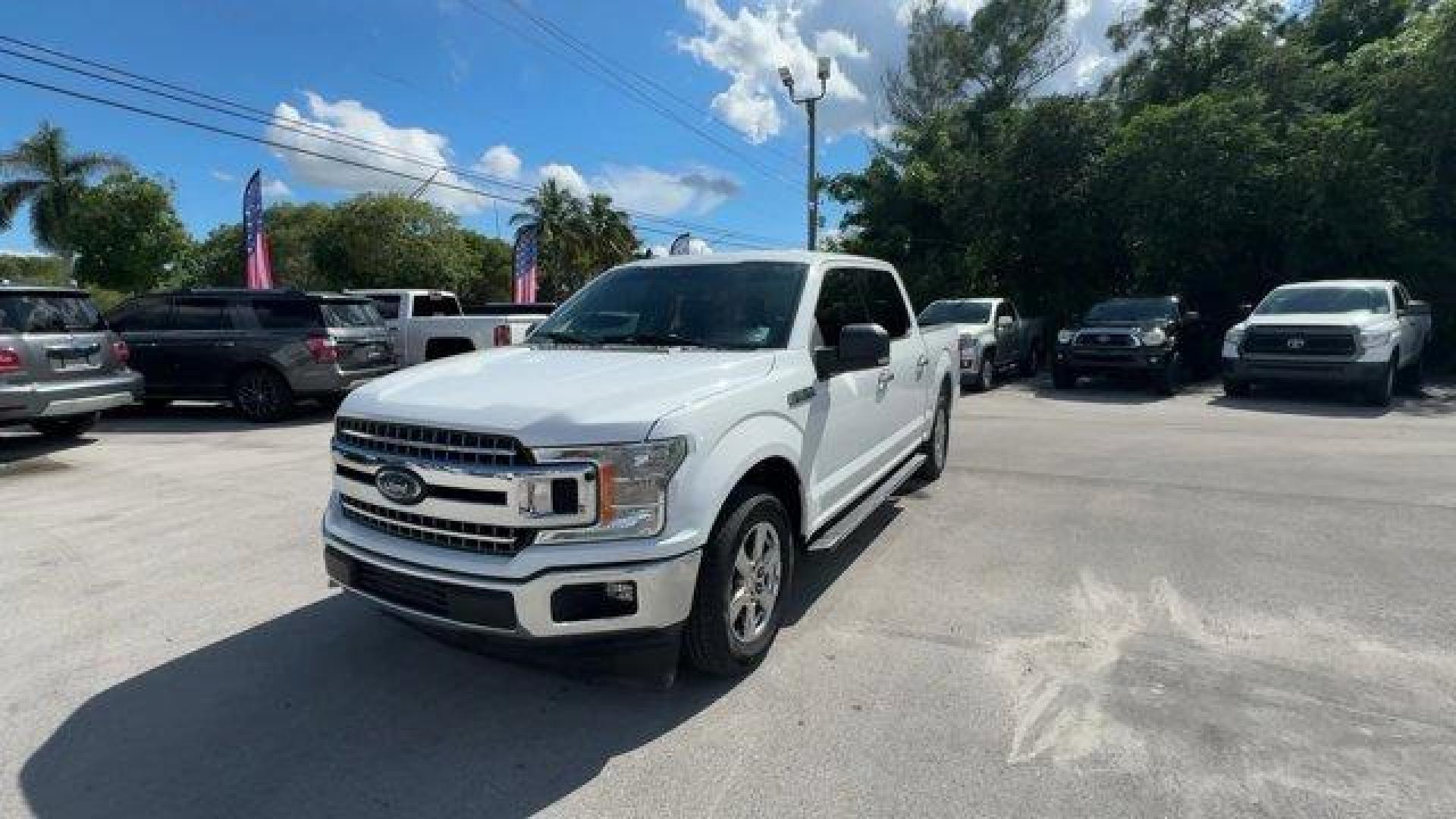 2019 White Ford F-150 (1FTEW1C53KF) with an 8 5.0 L engine, Automatic transmission, located at 27610 S Dixie Hwy, Homestead, FL, 33032, (305) 749-2348, 25.510241, -80.438301 - Delivers 25 Highway MPG and 19 City MPG! This Ford F-150 delivers a Regular Unleaded V8 5.0 L engine powering this Automatic transmission. Variable Intermittent Wipers, Urethane Gear Shifter Material, Transmission w/Driver Selectable Mode and SelectShift Sequential Shift Control.*This Ford F-150 Com - Photo#0