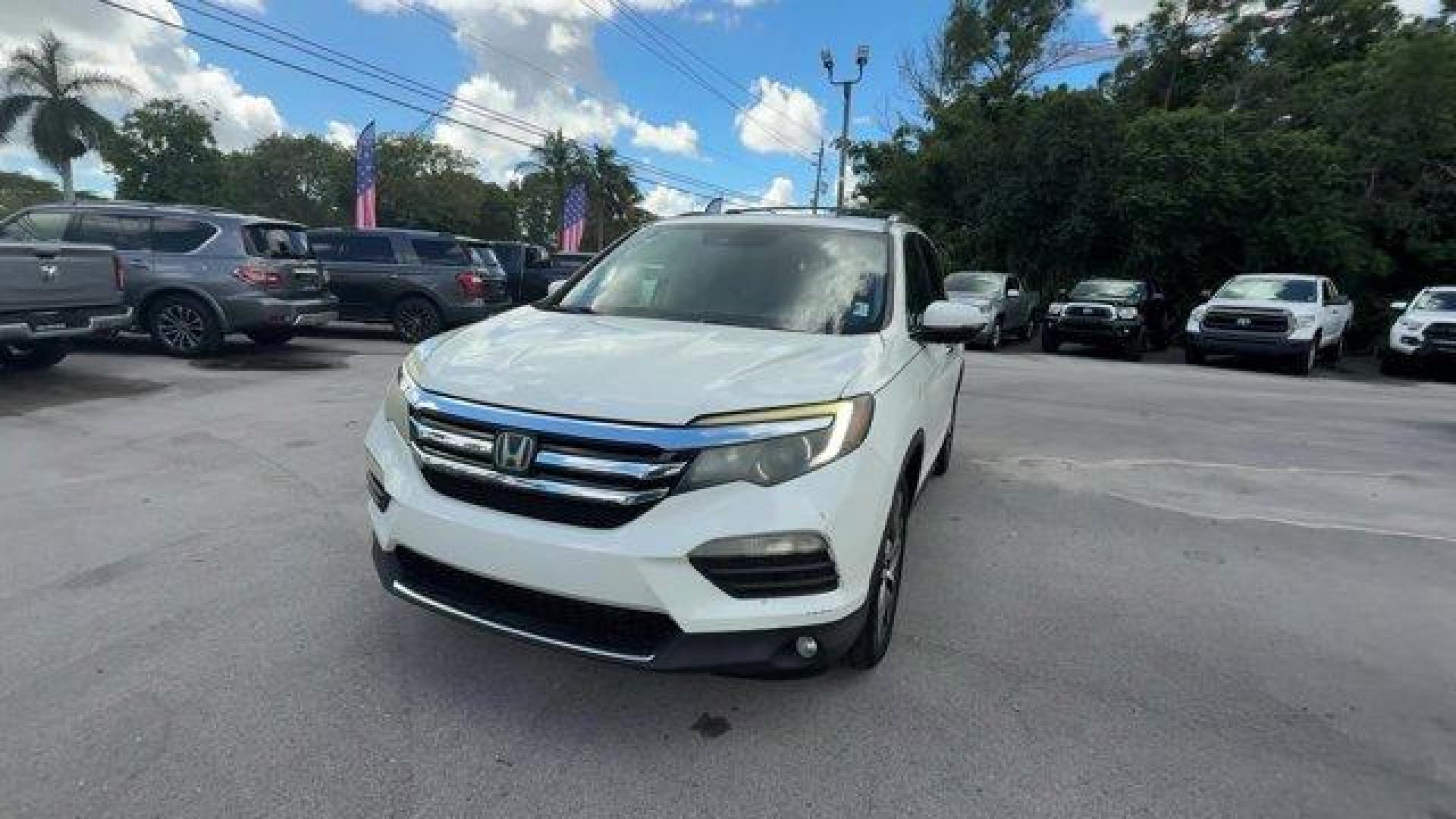 2017 White Honda Pilot (5FNYF5H97HB) with an 6 3.5 L engine, Automatic transmission, located at 27610 S Dixie Hwy, Homestead, FL, 33032, (305) 749-2348, 25.510241, -80.438301 - IIHS Top Safety Pick+. Scores 27 Highway MPG and 20 City MPG! This Honda Pilot boasts a Regular Unleaded V-6 3.5 L/212 engine powering this Automatic transmission. Window Grid Antenna, Wheels: 20 Alloy, Wheels w/Machined Accents.*This Honda Pilot Comes Equipped with These Options *VSA Electronic Sta - Photo#0