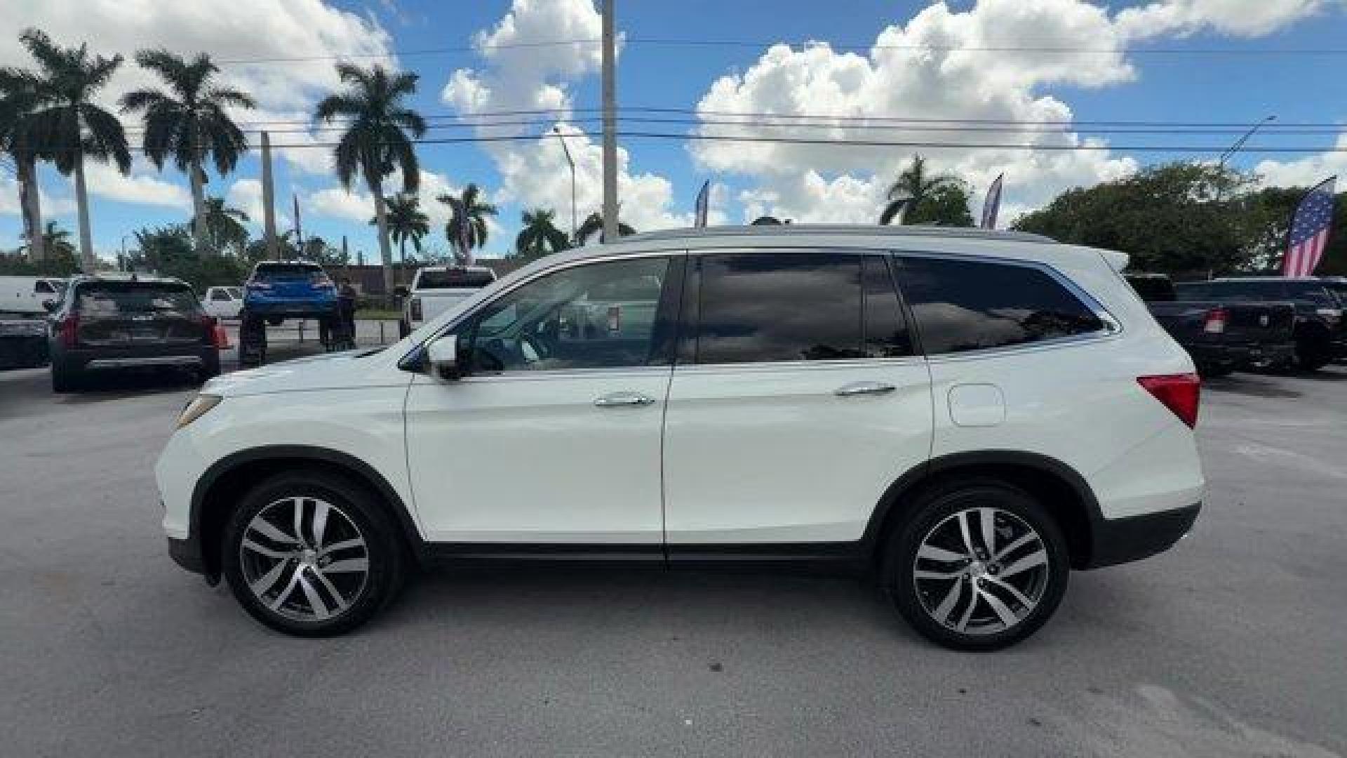 2017 White Honda Pilot (5FNYF5H97HB) with an 6 3.5 L engine, Automatic transmission, located at 27610 S Dixie Hwy, Homestead, FL, 33032, (305) 749-2348, 25.510241, -80.438301 - IIHS Top Safety Pick+. Scores 27 Highway MPG and 20 City MPG! This Honda Pilot boasts a Regular Unleaded V-6 3.5 L/212 engine powering this Automatic transmission. Window Grid Antenna, Wheels: 20 Alloy, Wheels w/Machined Accents.*This Honda Pilot Comes Equipped with These Options *VSA Electronic Sta - Photo#1