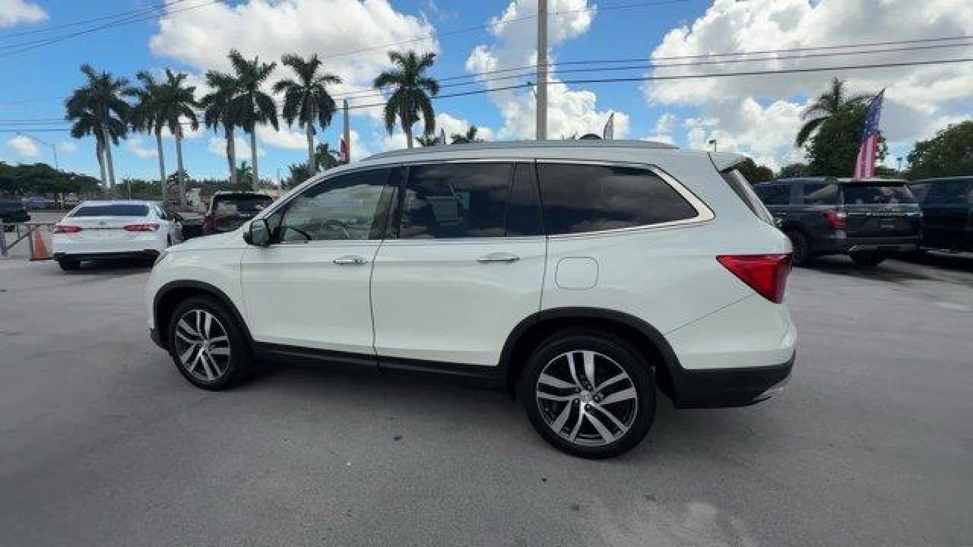 2017 White Honda Pilot (5FNYF5H97HB) with an 6 3.5 L engine, Automatic transmission, located at 27610 S Dixie Hwy, Homestead, FL, 33032, (305) 749-2348, 25.510241, -80.438301 - IIHS Top Safety Pick+. Scores 27 Highway MPG and 20 City MPG! This Honda Pilot boasts a Regular Unleaded V-6 3.5 L/212 engine powering this Automatic transmission. Window Grid Antenna, Wheels: 20 Alloy, Wheels w/Machined Accents.*This Honda Pilot Comes Equipped with These Options *VSA Electronic Sta - Photo#2
