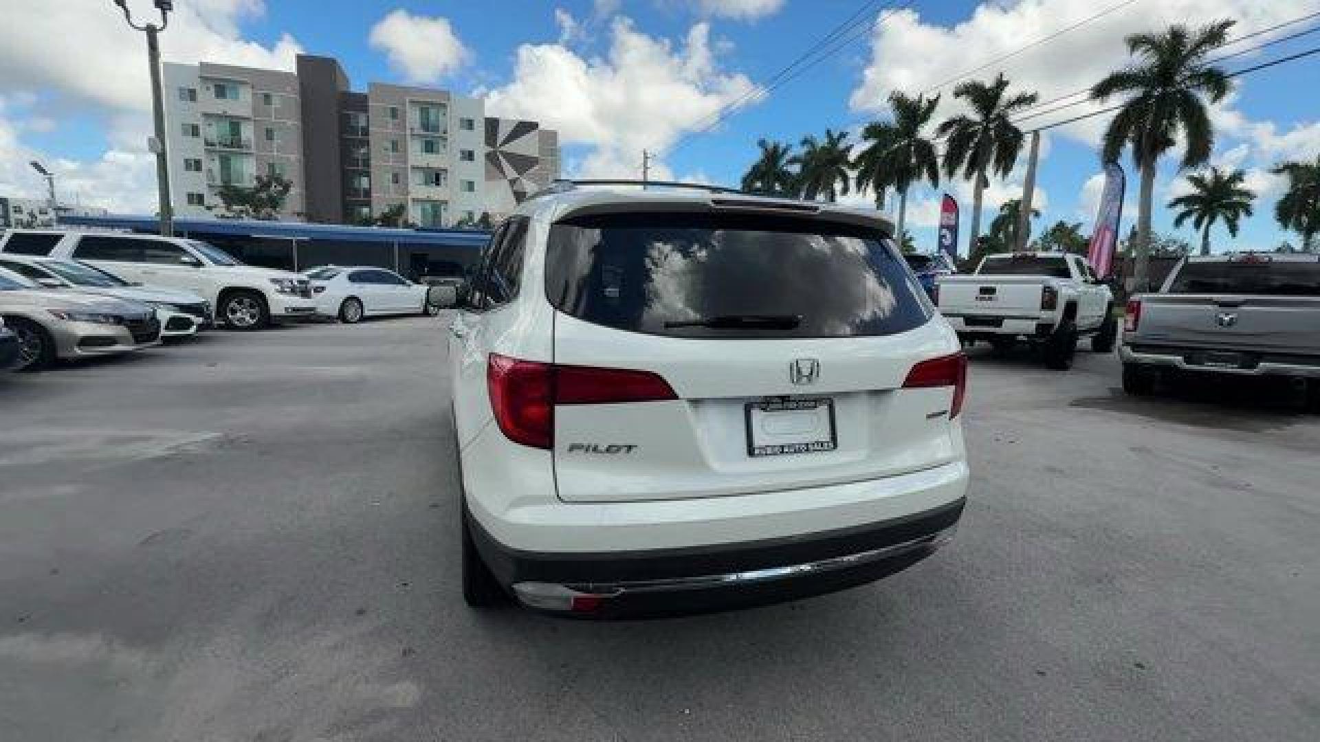 2017 White Honda Pilot (5FNYF5H97HB) with an 6 3.5 L engine, Automatic transmission, located at 27610 S Dixie Hwy, Homestead, FL, 33032, (305) 749-2348, 25.510241, -80.438301 - IIHS Top Safety Pick+. Scores 27 Highway MPG and 20 City MPG! This Honda Pilot boasts a Regular Unleaded V-6 3.5 L/212 engine powering this Automatic transmission. Window Grid Antenna, Wheels: 20 Alloy, Wheels w/Machined Accents.*This Honda Pilot Comes Equipped with These Options *VSA Electronic Sta - Photo#3