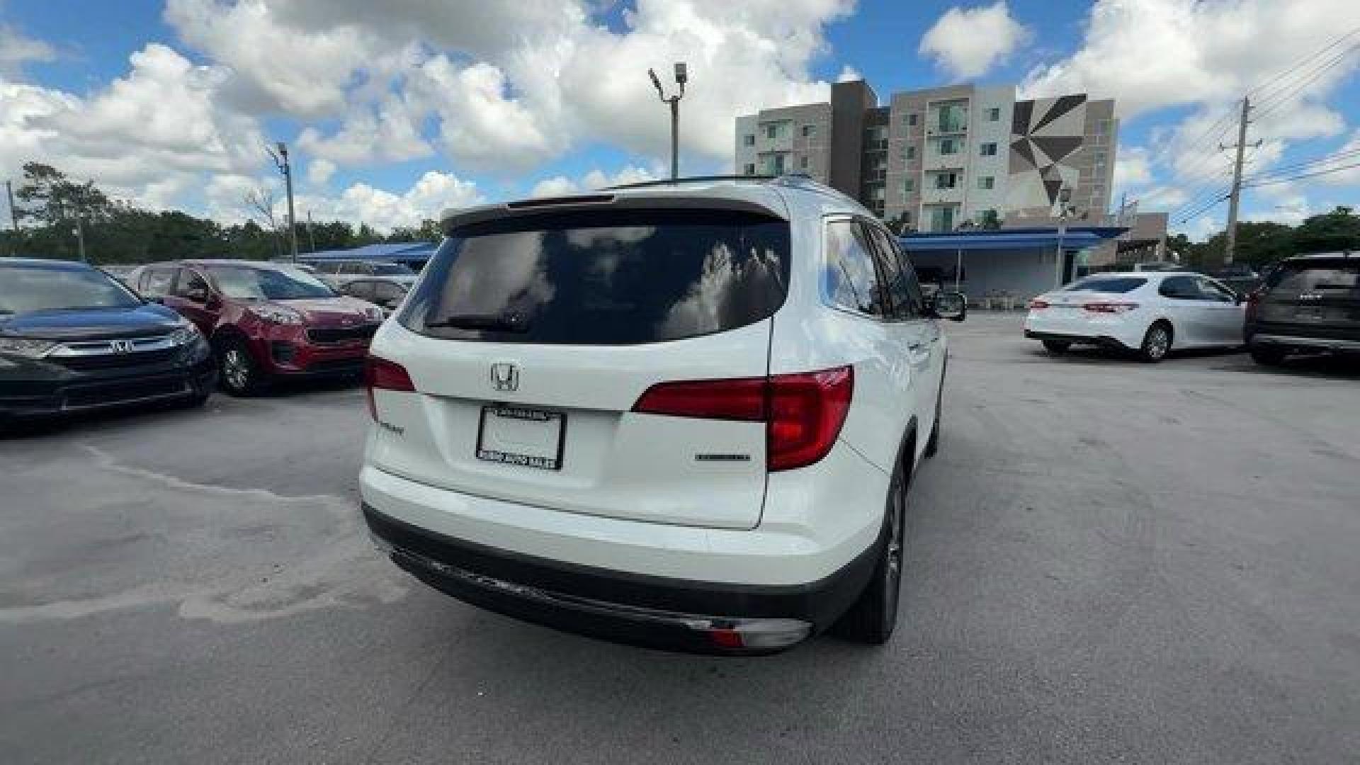 2017 White Honda Pilot (5FNYF5H97HB) with an 6 3.5 L engine, Automatic transmission, located at 27610 S Dixie Hwy, Homestead, FL, 33032, (305) 749-2348, 25.510241, -80.438301 - IIHS Top Safety Pick+. Scores 27 Highway MPG and 20 City MPG! This Honda Pilot boasts a Regular Unleaded V-6 3.5 L/212 engine powering this Automatic transmission. Window Grid Antenna, Wheels: 20 Alloy, Wheels w/Machined Accents.*This Honda Pilot Comes Equipped with These Options *VSA Electronic Sta - Photo#4
