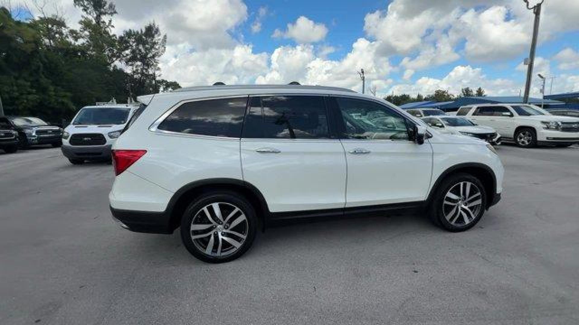 2017 White Honda Pilot (5FNYF5H97HB) with an 6 3.5 L engine, Automatic transmission, located at 27610 S Dixie Hwy, Homestead, FL, 33032, (305) 749-2348, 25.510241, -80.438301 - IIHS Top Safety Pick+. Scores 27 Highway MPG and 20 City MPG! This Honda Pilot boasts a Regular Unleaded V-6 3.5 L/212 engine powering this Automatic transmission. Window Grid Antenna, Wheels: 20 Alloy, Wheels w/Machined Accents.*This Honda Pilot Comes Equipped with These Options *VSA Electronic Sta - Photo#5
