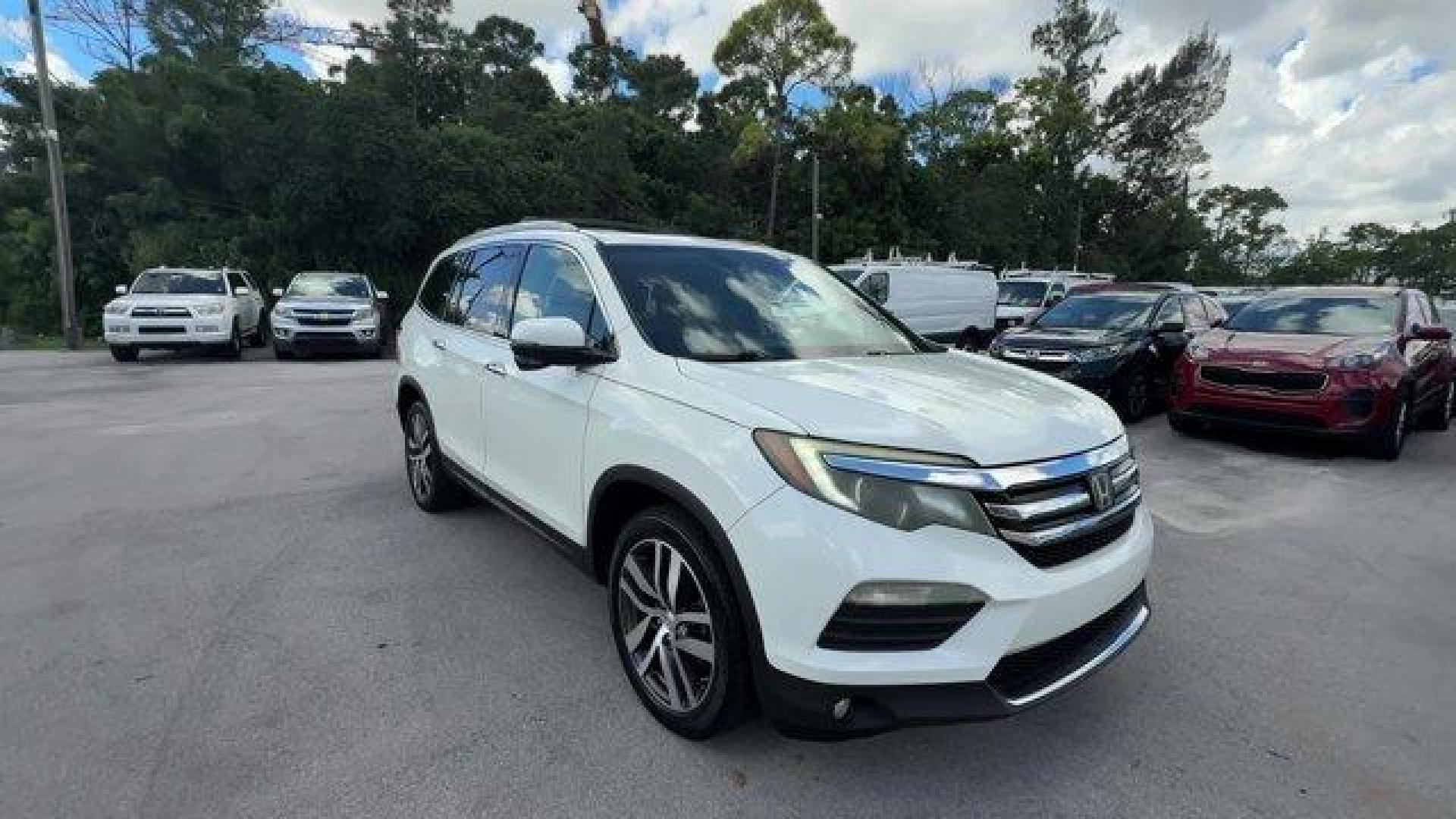 2017 White Honda Pilot (5FNYF5H97HB) with an 6 3.5 L engine, Automatic transmission, located at 27610 S Dixie Hwy, Homestead, FL, 33032, (305) 749-2348, 25.510241, -80.438301 - IIHS Top Safety Pick+. Scores 27 Highway MPG and 20 City MPG! This Honda Pilot boasts a Regular Unleaded V-6 3.5 L/212 engine powering this Automatic transmission. Window Grid Antenna, Wheels: 20 Alloy, Wheels w/Machined Accents.*This Honda Pilot Comes Equipped with These Options *VSA Electronic Sta - Photo#6