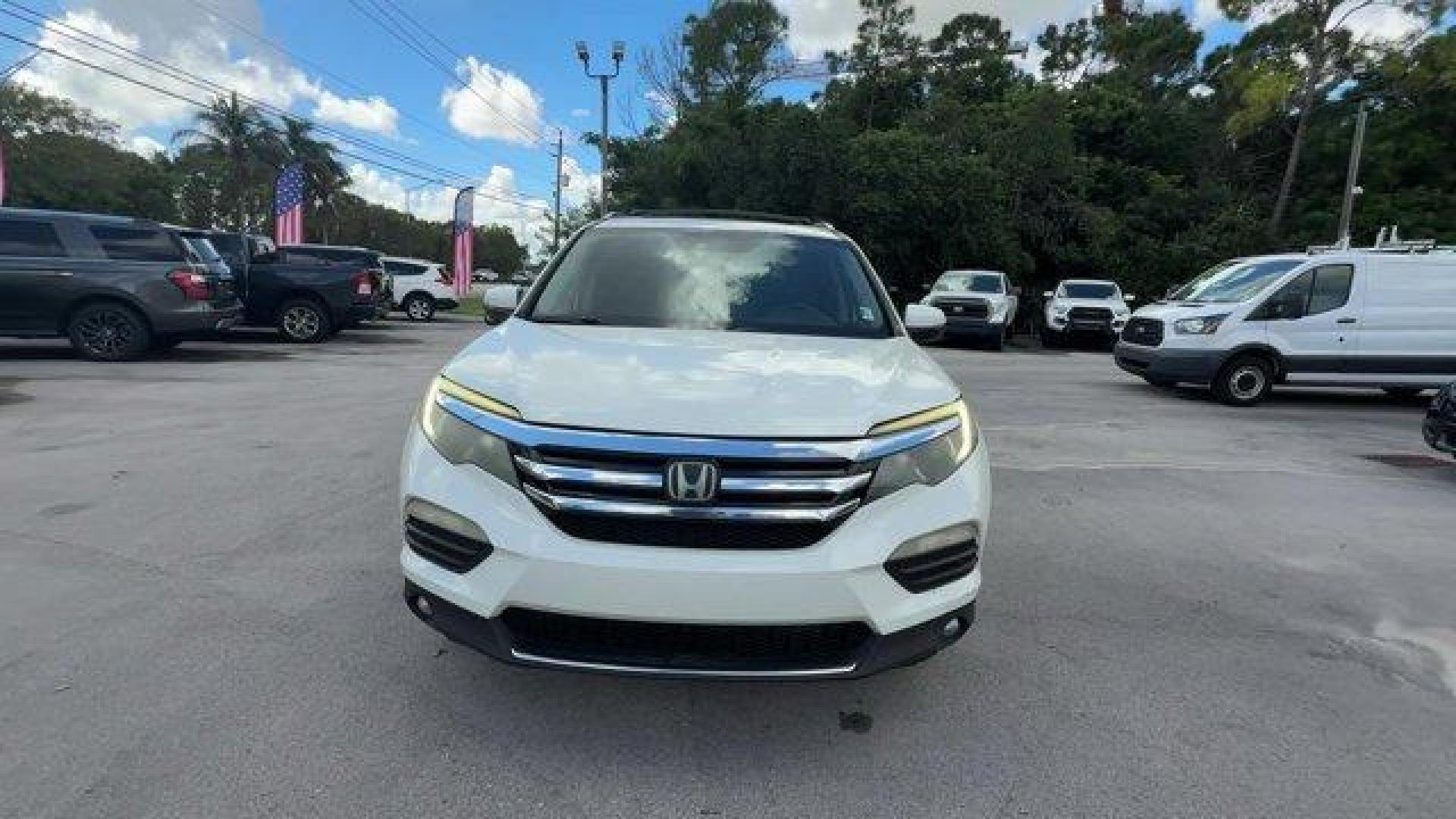 2017 White Honda Pilot (5FNYF5H97HB) with an 6 3.5 L engine, Automatic transmission, located at 27610 S Dixie Hwy, Homestead, FL, 33032, (305) 749-2348, 25.510241, -80.438301 - IIHS Top Safety Pick+. Scores 27 Highway MPG and 20 City MPG! This Honda Pilot boasts a Regular Unleaded V-6 3.5 L/212 engine powering this Automatic transmission. Window Grid Antenna, Wheels: 20 Alloy, Wheels w/Machined Accents.*This Honda Pilot Comes Equipped with These Options *VSA Electronic Sta - Photo#7