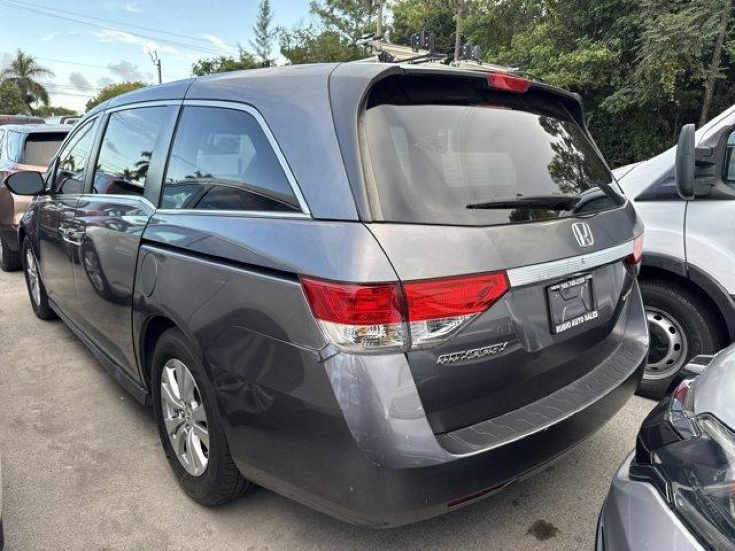 2016 Gray Honda Odyssey (5FNRL5H31GB) with an 6 3.5 L engine, Automatic transmission, located at 27610 S Dixie Hwy, Homestead, FL, 33032, (305) 749-2348, 25.510241, -80.438301 - IIHS Top Safety Pick. Scores 28 Highway MPG and 19 City MPG! This Honda Odyssey delivers a Regular Unleaded V-6 3.5 L/212 engine powering this Automatic transmission. Window Grid Antenna, Wheels: 17 x 7 Alloy, VSA Electronic Stability Control (ESC).* This Honda Odyssey Features the Following Options - Photo#1