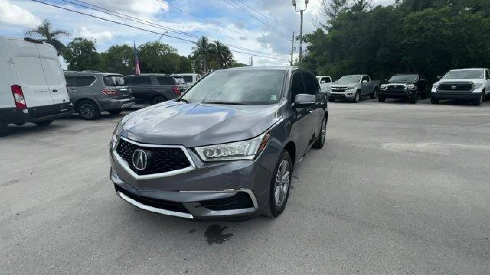 2020 Gray Acura MDX (5J8YD3H3XLL) with an 6 3.5 L engine, Automatic transmission, located at 27610 S Dixie Hwy, Homestead, FL, 33032, (305) 749-2348, 25.510241, -80.438301 - Delivers 27 Highway MPG and 20 City MPG! This Acura MDX delivers a Premium Unleaded V-6 3.5 L/212 engine powering this Automatic transmission. Window Grid Antenna, Vehicle Stability Assist Electronic Stability Control (ESC), Valet Function.*This Acura MDX Comes Equipped with These Options *Trunk/Hat - Photo#0