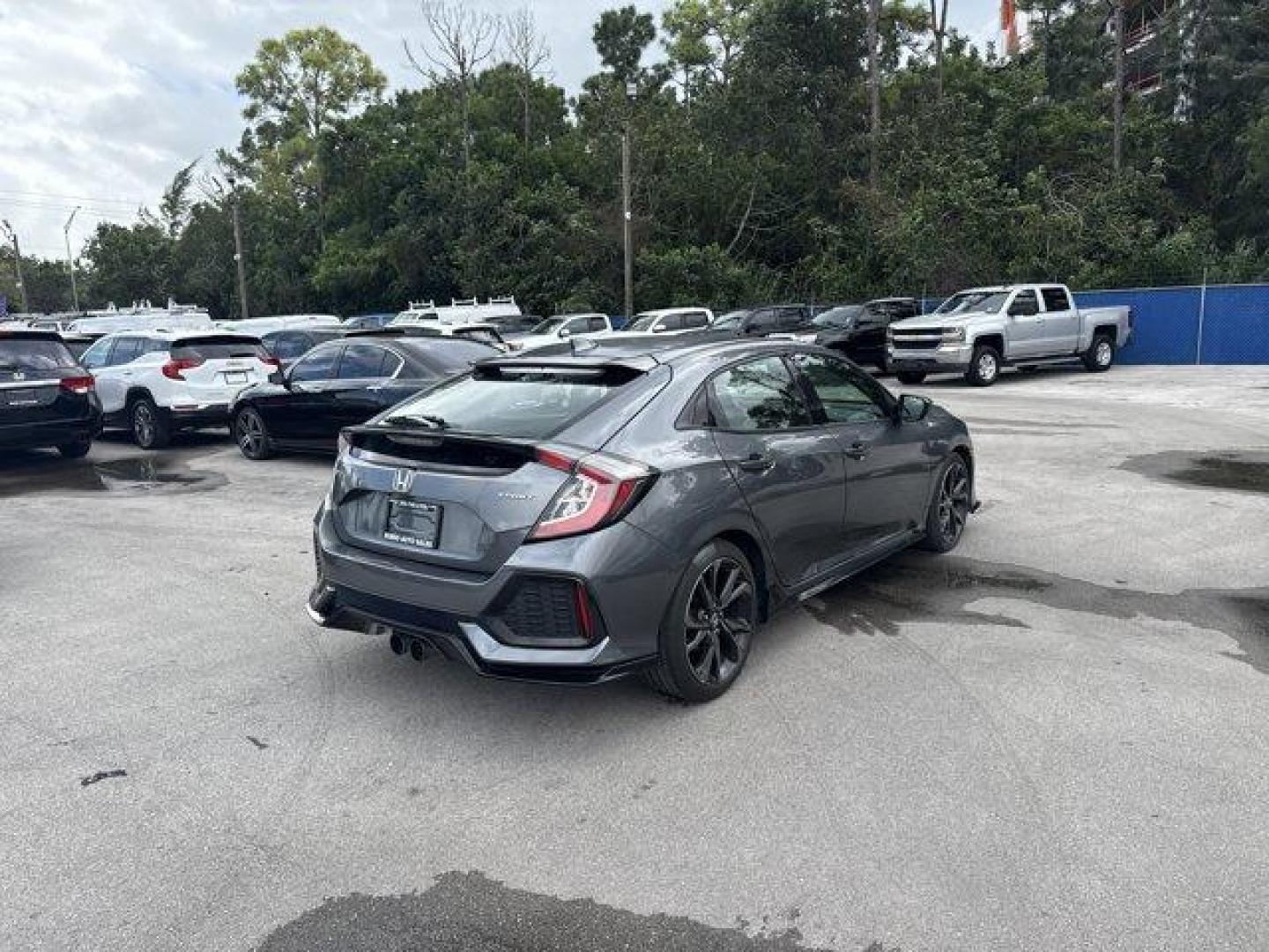 2017 Gray Honda Civic Hatchback (SHHFK7H40HU) with an 4 1.5 L engine, Variable transmission, located at 27610 S Dixie Hwy, Homestead, FL, 33032, (305) 749-2348, 25.510241, -80.438301 - KBB.com Brand Image Awards. Delivers 36 Highway MPG and 30 City MPG! This Honda Civic Hatchback boasts a Intercooled Turbo Premium Unleaded I-4 1.5 L/91 engine powering this Variable transmission. Wheels: 18 Alloy, Wheels w/Machined w/Painted Accents Accents, VSA Electronic Stability Control (ESC).* - Photo#4