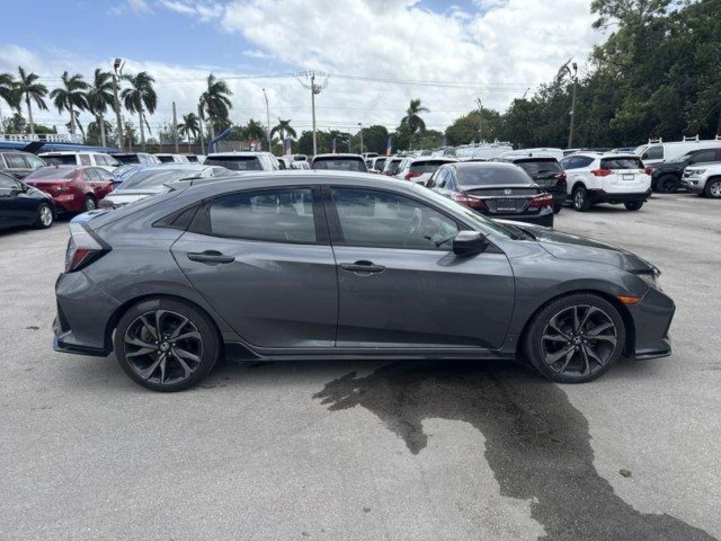 2017 Gray Honda Civic Hatchback (SHHFK7H40HU) with an 4 1.5 L engine, Variable transmission, located at 27610 S Dixie Hwy, Homestead, FL, 33032, (305) 749-2348, 25.510241, -80.438301 - KBB.com Brand Image Awards. Delivers 36 Highway MPG and 30 City MPG! This Honda Civic Hatchback boasts a Intercooled Turbo Premium Unleaded I-4 1.5 L/91 engine powering this Variable transmission. Wheels: 18 Alloy, Wheels w/Machined w/Painted Accents Accents, VSA Electronic Stability Control (ESC).* - Photo#5