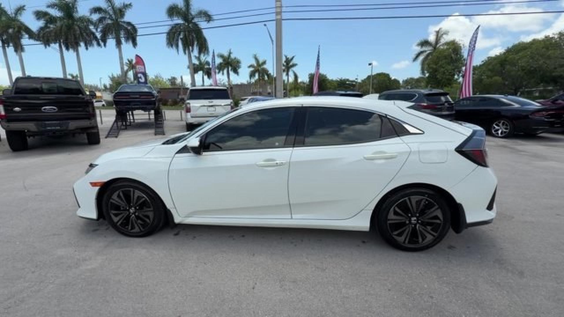 2018 White Honda Civic Hatchback (SHHFK7H51JU) with an 4 1.5 L engine, Variable transmission, located at 27610 S Dixie Hwy, Homestead, FL, 33032, (305) 749-2348, 25.510241, -80.438301 - KBB.com 10 Most Awarded Brands. Boasts 40 Highway MPG and 31 City MPG! This Honda Civic Hatchback boasts a Intercooled Turbo Regular Unleaded I-4 1.5 L/91 engine powering this Variable transmission. Wheels: 17 Alloy, Wheels w/Silver Accents, VSA Electronic Stability Control (ESC).*This Honda Civic H- Photo#1