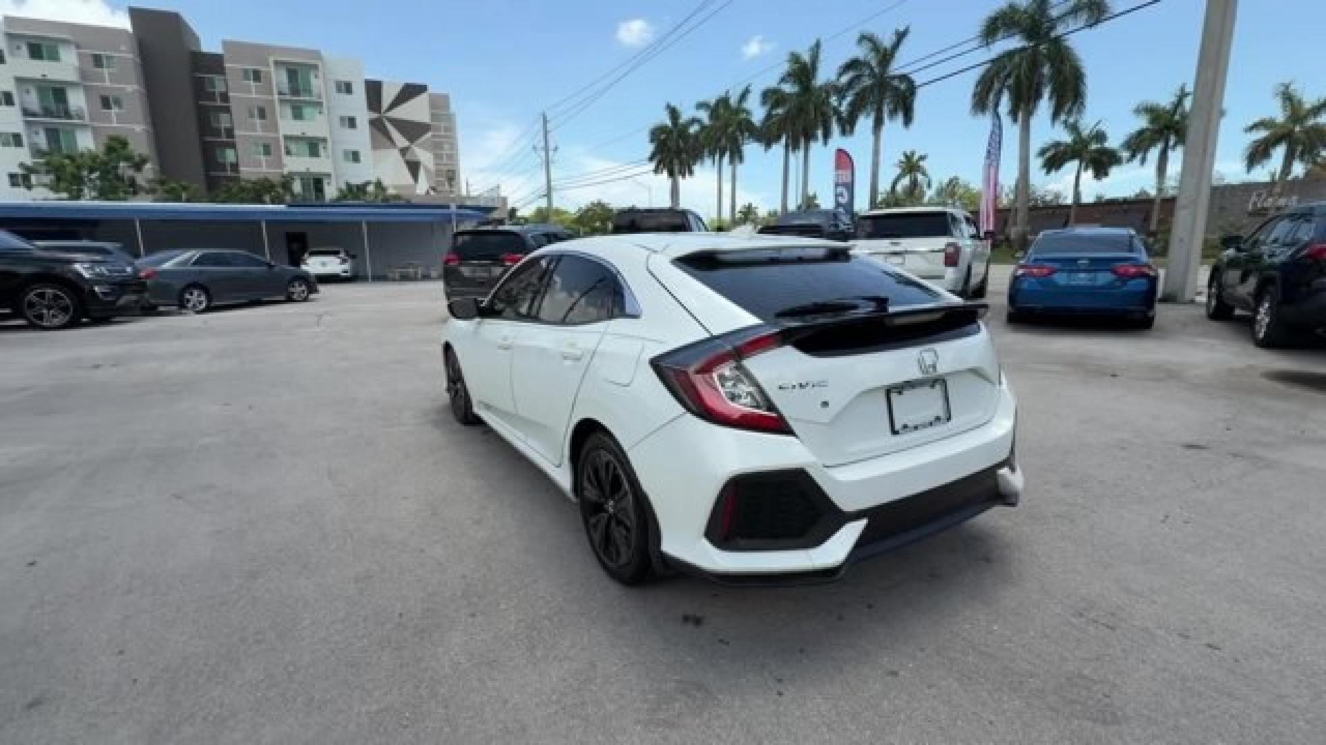 2018 White Honda Civic Hatchback (SHHFK7H51JU) with an 4 1.5 L engine, Variable transmission, located at 27610 S Dixie Hwy, Homestead, FL, 33032, (305) 749-2348, 25.510241, -80.438301 - KBB.com 10 Most Awarded Brands. Boasts 40 Highway MPG and 31 City MPG! This Honda Civic Hatchback boasts a Intercooled Turbo Regular Unleaded I-4 1.5 L/91 engine powering this Variable transmission. Wheels: 17 Alloy, Wheels w/Silver Accents, VSA Electronic Stability Control (ESC).*This Honda Civic H- Photo#2