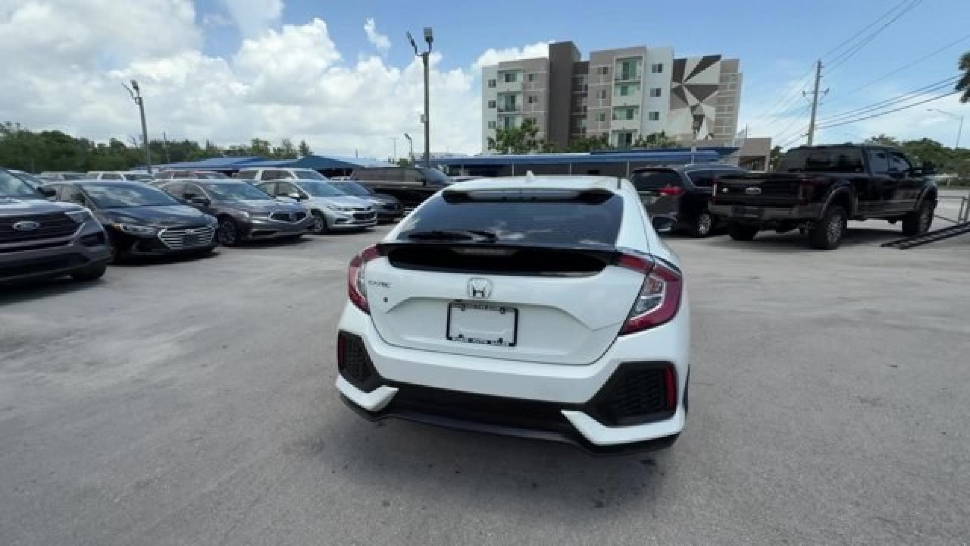 2018 White Honda Civic Hatchback (SHHFK7H51JU) with an 4 1.5 L engine, Variable transmission, located at 27610 S Dixie Hwy, Homestead, FL, 33032, (305) 749-2348, 25.510241, -80.438301 - KBB.com 10 Most Awarded Brands. Boasts 40 Highway MPG and 31 City MPG! This Honda Civic Hatchback boasts a Intercooled Turbo Regular Unleaded I-4 1.5 L/91 engine powering this Variable transmission. Wheels: 17 Alloy, Wheels w/Silver Accents, VSA Electronic Stability Control (ESC).*This Honda Civic H- Photo#3