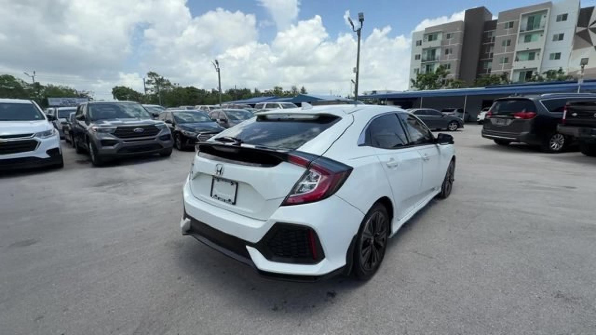 2018 White Honda Civic Hatchback (SHHFK7H51JU) with an 4 1.5 L engine, Variable transmission, located at 27610 S Dixie Hwy, Homestead, FL, 33032, (305) 749-2348, 25.510241, -80.438301 - KBB.com 10 Most Awarded Brands. Boasts 40 Highway MPG and 31 City MPG! This Honda Civic Hatchback boasts a Intercooled Turbo Regular Unleaded I-4 1.5 L/91 engine powering this Variable transmission. Wheels: 17 Alloy, Wheels w/Silver Accents, VSA Electronic Stability Control (ESC).*This Honda Civic H- Photo#4