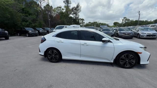 2018 White Honda Civic Hatchback (SHHFK7H51JU) with an 4 1.5 L engine, Variable transmission, located at 27610 S Dixie Hwy, Homestead, FL, 33032, (305) 749-2348, 25.510241, -80.438301 - KBB.com 10 Most Awarded Brands. Boasts 40 Highway MPG and 31 City MPG! This Honda Civic Hatchback boasts a Intercooled Turbo Regular Unleaded I-4 1.5 L/91 engine powering this Variable transmission. Wheels: 17 Alloy, Wheels w/Silver Accents, VSA Electronic Stability Control (ESC).*This Honda Civic H- Photo#5