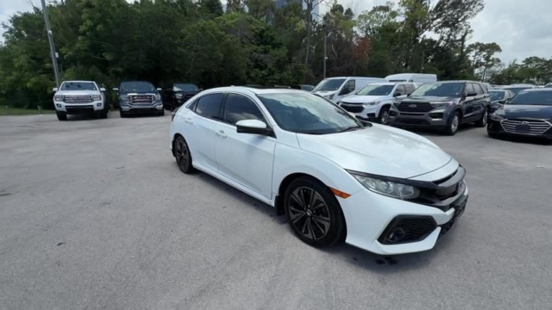 2018 White Honda Civic Hatchback (SHHFK7H51JU) with an 4 1.5 L engine, Variable transmission, located at 27610 S Dixie Hwy, Homestead, FL, 33032, (305) 749-2348, 25.510241, -80.438301 - KBB.com 10 Most Awarded Brands. Boasts 40 Highway MPG and 31 City MPG! This Honda Civic Hatchback boasts a Intercooled Turbo Regular Unleaded I-4 1.5 L/91 engine powering this Variable transmission. Wheels: 17 Alloy, Wheels w/Silver Accents, VSA Electronic Stability Control (ESC).*This Honda Civic H- Photo#6