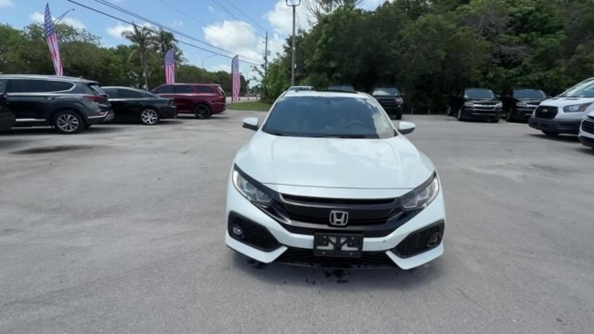 2018 White Honda Civic Hatchback (SHHFK7H51JU) with an 4 1.5 L engine, Variable transmission, located at 27610 S Dixie Hwy, Homestead, FL, 33032, (305) 749-2348, 25.510241, -80.438301 - KBB.com 10 Most Awarded Brands. Boasts 40 Highway MPG and 31 City MPG! This Honda Civic Hatchback boasts a Intercooled Turbo Regular Unleaded I-4 1.5 L/91 engine powering this Variable transmission. Wheels: 17 Alloy, Wheels w/Silver Accents, VSA Electronic Stability Control (ESC).*This Honda Civic H- Photo#7