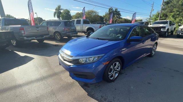 2017 Blue Honda Civic Sedan (19XFC2F52HE) with an 4 2.0 L engine, Variable transmission, located at 27610 S Dixie Hwy, Homestead, FL, 33032, (305) 749-2348, 25.510241, -80.438301 - IIHS Top Safety Pick. Only 95,993 Miles! Boasts 40 Highway MPG and 31 City MPG! This Honda Civic Sedan delivers a Regular Unleaded I-4 2.0 L/122 engine powering this Variable transmission. Wheels: 16 w/Full Covers, VSA Electronic Stability Control (ESC), Valet Function.* This Honda Civic Sedan Featu - Photo#0