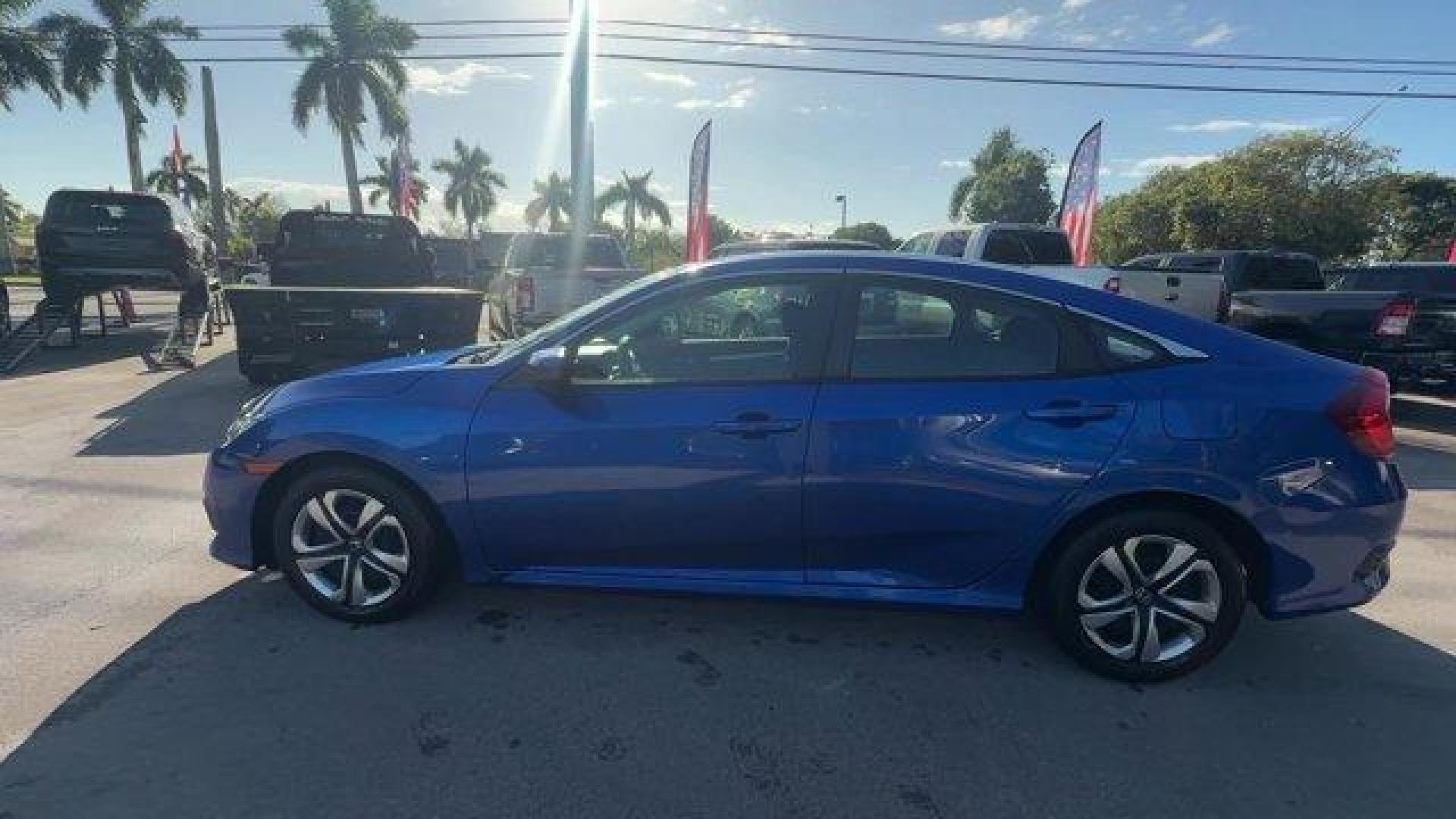 2017 Blue Honda Civic Sedan (19XFC2F52HE) with an 4 2.0 L engine, Variable transmission, located at 27610 S Dixie Hwy, Homestead, FL, 33032, (305) 749-2348, 25.510241, -80.438301 - IIHS Top Safety Pick. Only 95,993 Miles! Boasts 40 Highway MPG and 31 City MPG! This Honda Civic Sedan delivers a Regular Unleaded I-4 2.0 L/122 engine powering this Variable transmission. Wheels: 16 w/Full Covers, VSA Electronic Stability Control (ESC), Valet Function.* This Honda Civic Sedan Featu - Photo#1