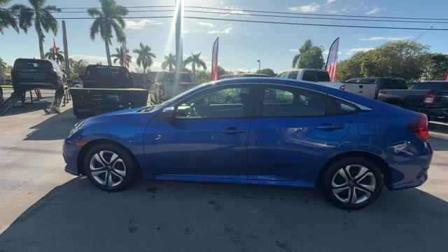 2017 Blue Honda Civic Sedan (19XFC2F52HE) with an 4 2.0 L engine, Variable transmission, located at 27610 S Dixie Hwy, Homestead, FL, 33032, (305) 749-2348, 25.510241, -80.438301 - IIHS Top Safety Pick. Only 95,993 Miles! Boasts 40 Highway MPG and 31 City MPG! This Honda Civic Sedan delivers a Regular Unleaded I-4 2.0 L/122 engine powering this Variable transmission. Wheels: 16 w/Full Covers, VSA Electronic Stability Control (ESC), Valet Function.* This Honda Civic Sedan Featu - Photo#1