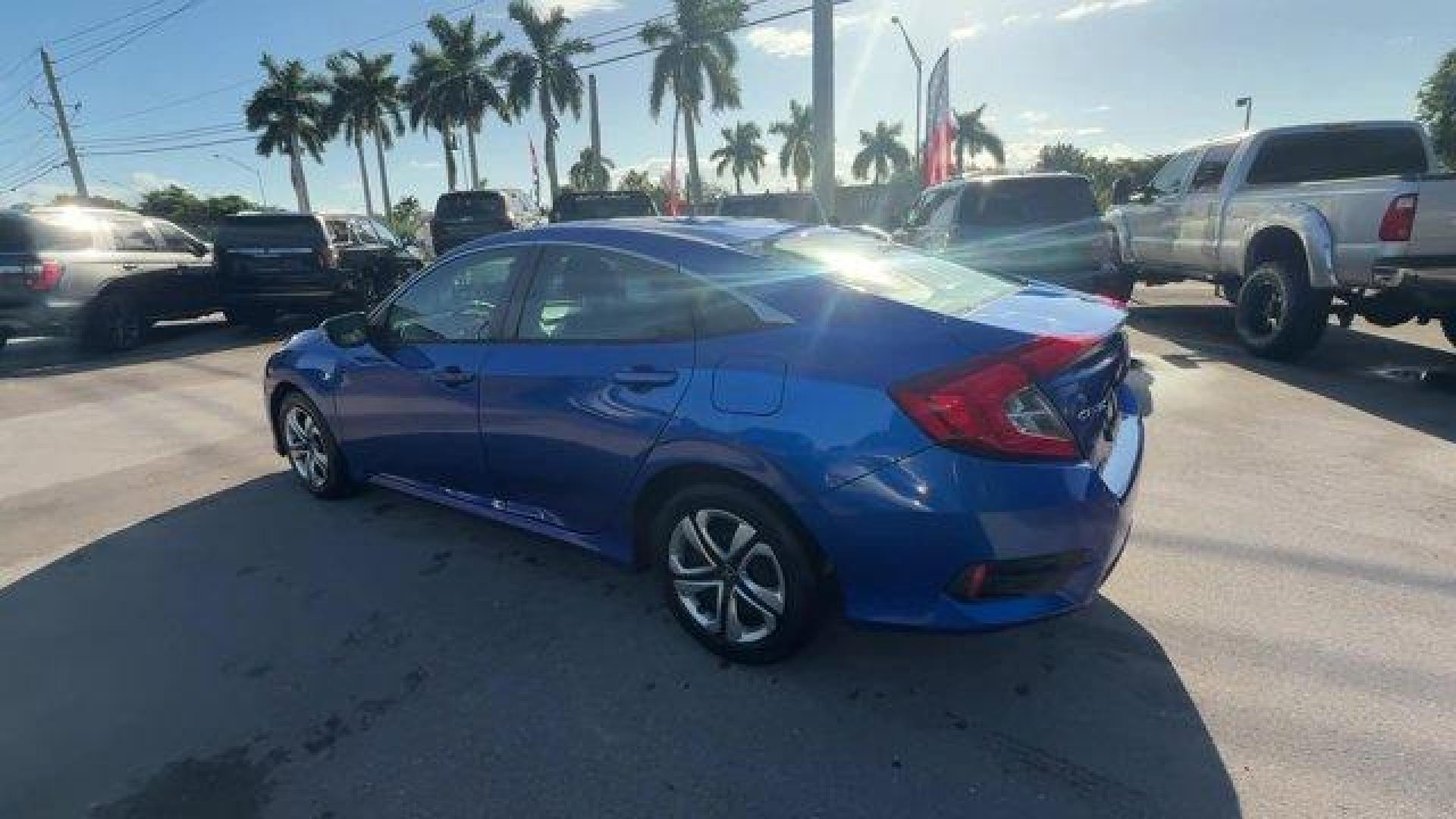 2017 Blue Honda Civic Sedan (19XFC2F52HE) with an 4 2.0 L engine, Variable transmission, located at 27610 S Dixie Hwy, Homestead, FL, 33032, (305) 749-2348, 25.510241, -80.438301 - IIHS Top Safety Pick. Only 95,993 Miles! Boasts 40 Highway MPG and 31 City MPG! This Honda Civic Sedan delivers a Regular Unleaded I-4 2.0 L/122 engine powering this Variable transmission. Wheels: 16 w/Full Covers, VSA Electronic Stability Control (ESC), Valet Function.* This Honda Civic Sedan Featu - Photo#2