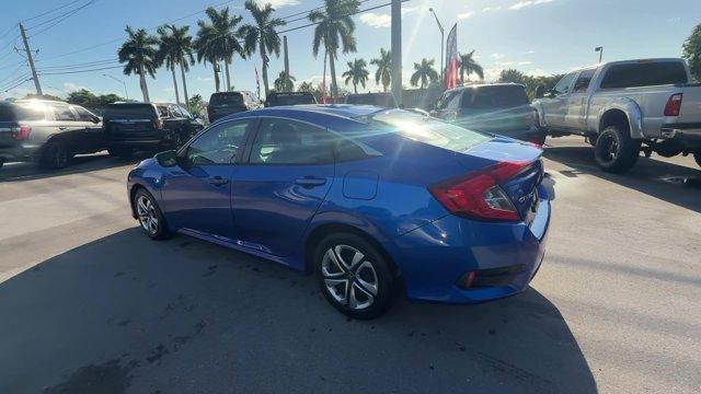 2017 Blue Honda Civic Sedan (19XFC2F52HE) with an 4 2.0 L engine, Variable transmission, located at 27610 S Dixie Hwy, Homestead, FL, 33032, (305) 749-2348, 25.510241, -80.438301 - IIHS Top Safety Pick. Only 95,993 Miles! Boasts 40 Highway MPG and 31 City MPG! This Honda Civic Sedan delivers a Regular Unleaded I-4 2.0 L/122 engine powering this Variable transmission. Wheels: 16 w/Full Covers, VSA Electronic Stability Control (ESC), Valet Function.* This Honda Civic Sedan Featu - Photo#2