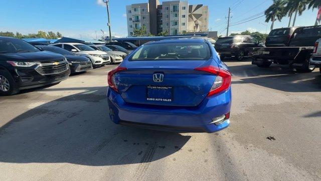 2017 Blue Honda Civic Sedan (19XFC2F52HE) with an 4 2.0 L engine, Variable transmission, located at 27610 S Dixie Hwy, Homestead, FL, 33032, (305) 749-2348, 25.510241, -80.438301 - IIHS Top Safety Pick. Only 95,993 Miles! Boasts 40 Highway MPG and 31 City MPG! This Honda Civic Sedan delivers a Regular Unleaded I-4 2.0 L/122 engine powering this Variable transmission. Wheels: 16 w/Full Covers, VSA Electronic Stability Control (ESC), Valet Function.* This Honda Civic Sedan Featu - Photo#3