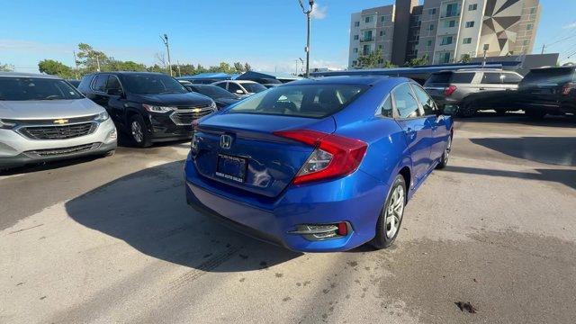 2017 Blue Honda Civic Sedan (19XFC2F52HE) with an 4 2.0 L engine, Variable transmission, located at 27610 S Dixie Hwy, Homestead, FL, 33032, (305) 749-2348, 25.510241, -80.438301 - IIHS Top Safety Pick. Only 95,993 Miles! Boasts 40 Highway MPG and 31 City MPG! This Honda Civic Sedan delivers a Regular Unleaded I-4 2.0 L/122 engine powering this Variable transmission. Wheels: 16 w/Full Covers, VSA Electronic Stability Control (ESC), Valet Function.* This Honda Civic Sedan Featu - Photo#4