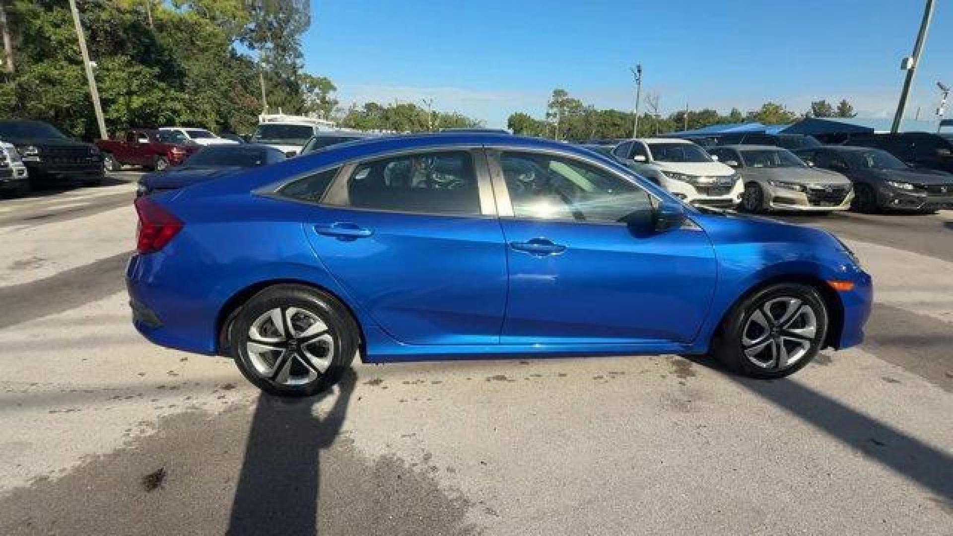 2017 Blue Honda Civic Sedan (19XFC2F52HE) with an 4 2.0 L engine, Variable transmission, located at 27610 S Dixie Hwy, Homestead, FL, 33032, (305) 749-2348, 25.510241, -80.438301 - IIHS Top Safety Pick. Only 95,993 Miles! Boasts 40 Highway MPG and 31 City MPG! This Honda Civic Sedan delivers a Regular Unleaded I-4 2.0 L/122 engine powering this Variable transmission. Wheels: 16 w/Full Covers, VSA Electronic Stability Control (ESC), Valet Function.* This Honda Civic Sedan Featu - Photo#5