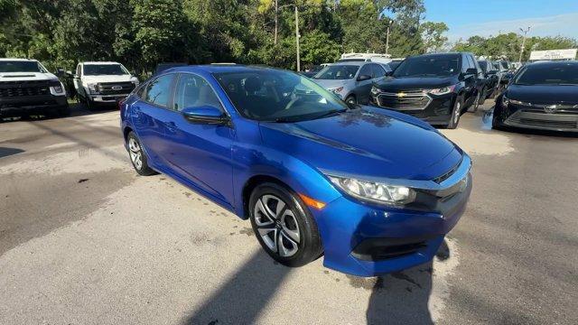2017 Blue Honda Civic Sedan (19XFC2F52HE) with an 4 2.0 L engine, Variable transmission, located at 27610 S Dixie Hwy, Homestead, FL, 33032, (305) 749-2348, 25.510241, -80.438301 - IIHS Top Safety Pick. Only 95,993 Miles! Boasts 40 Highway MPG and 31 City MPG! This Honda Civic Sedan delivers a Regular Unleaded I-4 2.0 L/122 engine powering this Variable transmission. Wheels: 16 w/Full Covers, VSA Electronic Stability Control (ESC), Valet Function.* This Honda Civic Sedan Featu - Photo#6