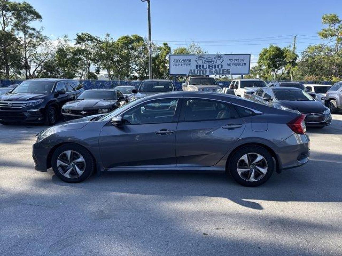 2017 Gray Honda Civic Sedan (19XFC2F56HE) with an 4 2.0 L engine, Variable transmission, located at 27610 S Dixie Hwy, Homestead, FL, 33032, (305) 749-2348, 25.510241, -80.438301 - IIHS Top Safety Pick. Boasts 40 Highway MPG and 31 City MPG! This Honda Civic Sedan delivers a Regular Unleaded I-4 2.0 L/122 engine powering this Variable transmission. Wheels: 16 w/Full Covers, VSA Electronic Stability Control (ESC), Valet Function.*This Honda Civic Sedan Comes Equipped with These - Photo#1