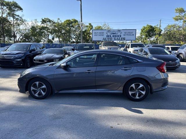2017 Gray Honda Civic Sedan (19XFC2F56HE) with an 4 2.0 L engine, Variable transmission, located at 27610 S Dixie Hwy, Homestead, FL, 33032, (305) 749-2348, 25.510241, -80.438301 - IIHS Top Safety Pick. Boasts 40 Highway MPG and 31 City MPG! This Honda Civic Sedan delivers a Regular Unleaded I-4 2.0 L/122 engine powering this Variable transmission. Wheels: 16 w/Full Covers, VSA Electronic Stability Control (ESC), Valet Function.*This Honda Civic Sedan Comes Equipped with These - Photo#1