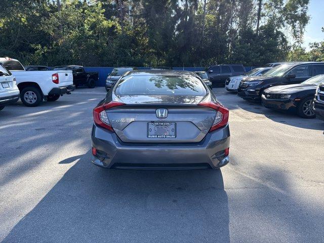 2017 Gray Honda Civic Sedan (19XFC2F56HE) with an 4 2.0 L engine, Variable transmission, located at 27610 S Dixie Hwy, Homestead, FL, 33032, (305) 749-2348, 25.510241, -80.438301 - IIHS Top Safety Pick. Boasts 40 Highway MPG and 31 City MPG! This Honda Civic Sedan delivers a Regular Unleaded I-4 2.0 L/122 engine powering this Variable transmission. Wheels: 16 w/Full Covers, VSA Electronic Stability Control (ESC), Valet Function.*This Honda Civic Sedan Comes Equipped with These - Photo#3