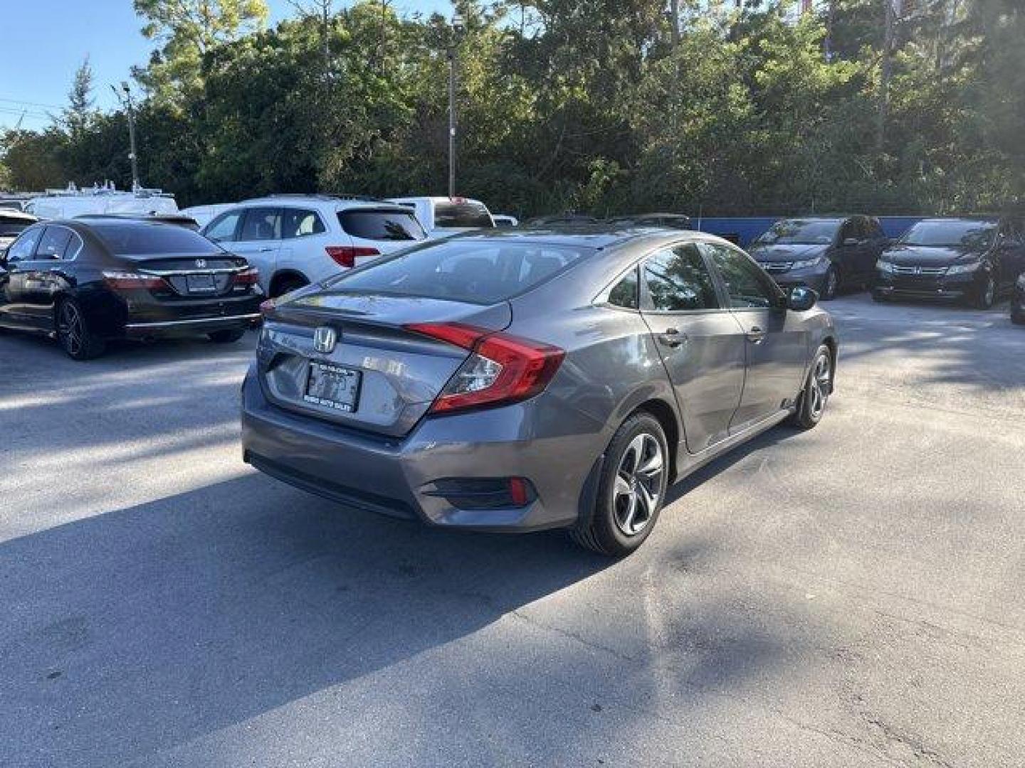 2017 Gray Honda Civic Sedan (19XFC2F56HE) with an 4 2.0 L engine, Variable transmission, located at 27610 S Dixie Hwy, Homestead, FL, 33032, (305) 749-2348, 25.510241, -80.438301 - IIHS Top Safety Pick. Boasts 40 Highway MPG and 31 City MPG! This Honda Civic Sedan delivers a Regular Unleaded I-4 2.0 L/122 engine powering this Variable transmission. Wheels: 16 w/Full Covers, VSA Electronic Stability Control (ESC), Valet Function.*This Honda Civic Sedan Comes Equipped with These - Photo#4