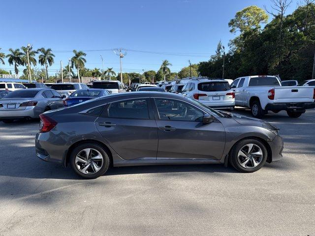 2017 Gray Honda Civic Sedan (19XFC2F56HE) with an 4 2.0 L engine, Variable transmission, located at 27610 S Dixie Hwy, Homestead, FL, 33032, (305) 749-2348, 25.510241, -80.438301 - IIHS Top Safety Pick. Boasts 40 Highway MPG and 31 City MPG! This Honda Civic Sedan delivers a Regular Unleaded I-4 2.0 L/122 engine powering this Variable transmission. Wheels: 16 w/Full Covers, VSA Electronic Stability Control (ESC), Valet Function.*This Honda Civic Sedan Comes Equipped with These - Photo#5