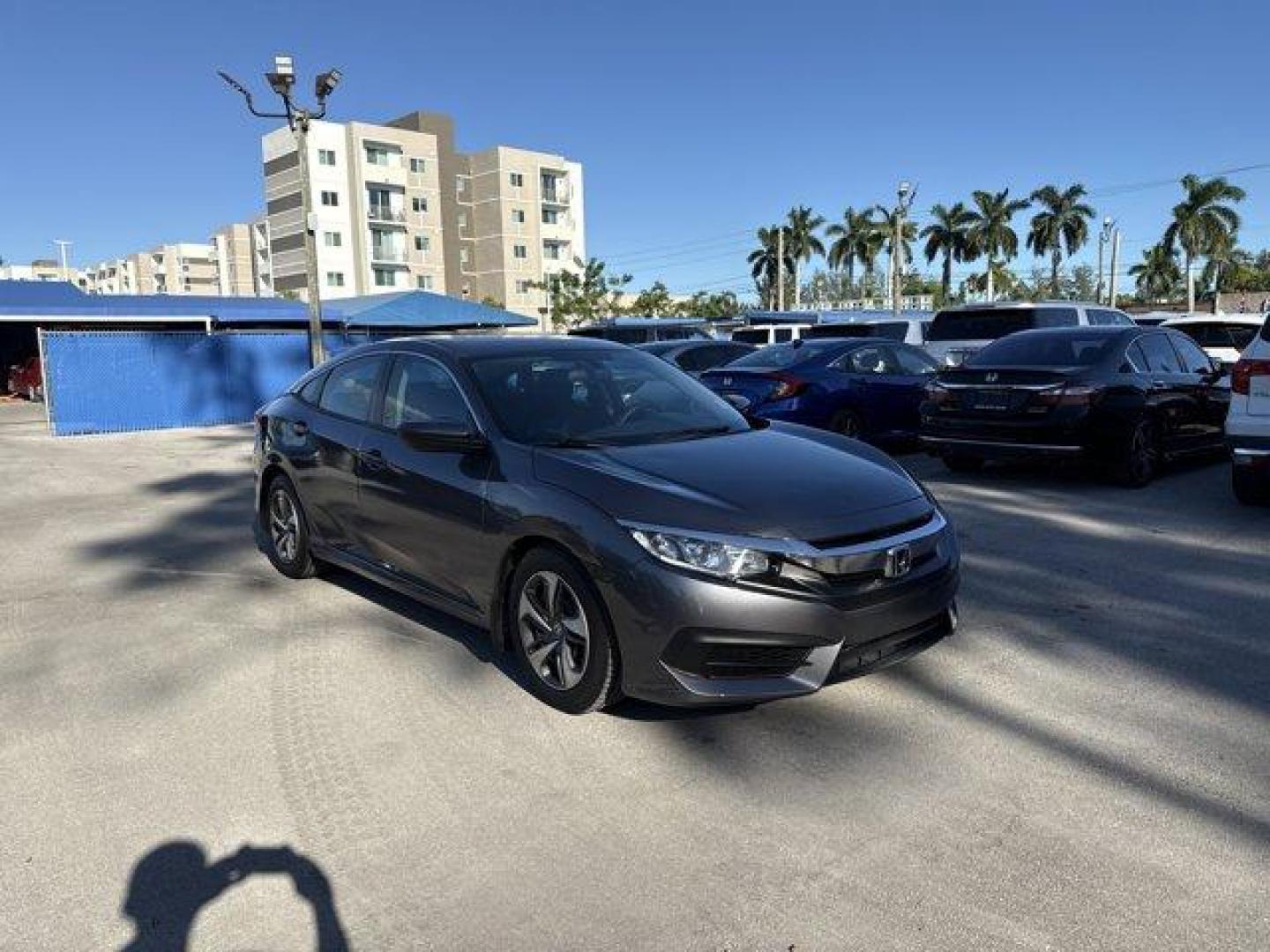 2017 Gray Honda Civic Sedan (19XFC2F56HE) with an 4 2.0 L engine, Variable transmission, located at 27610 S Dixie Hwy, Homestead, FL, 33032, (305) 749-2348, 25.510241, -80.438301 - IIHS Top Safety Pick. Boasts 40 Highway MPG and 31 City MPG! This Honda Civic Sedan delivers a Regular Unleaded I-4 2.0 L/122 engine powering this Variable transmission. Wheels: 16 w/Full Covers, VSA Electronic Stability Control (ESC), Valet Function.*This Honda Civic Sedan Comes Equipped with These - Photo#6
