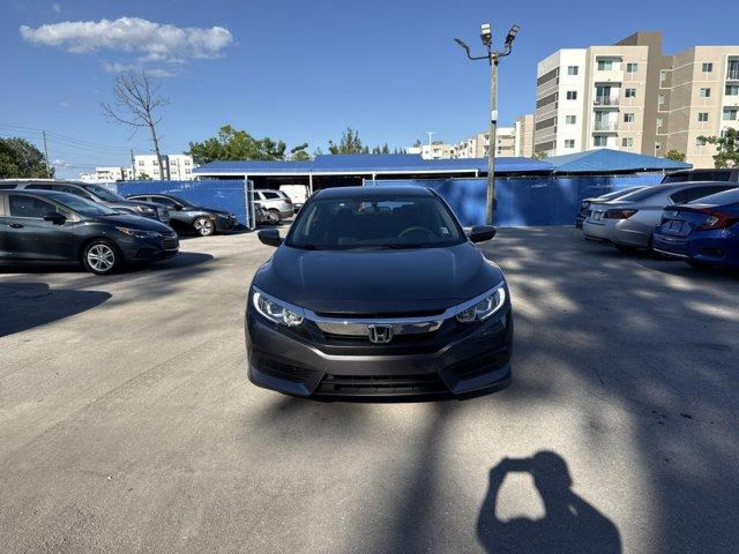 2017 Gray Honda Civic Sedan (19XFC2F56HE) with an 4 2.0 L engine, Variable transmission, located at 27610 S Dixie Hwy, Homestead, FL, 33032, (305) 749-2348, 25.510241, -80.438301 - IIHS Top Safety Pick. Boasts 40 Highway MPG and 31 City MPG! This Honda Civic Sedan delivers a Regular Unleaded I-4 2.0 L/122 engine powering this Variable transmission. Wheels: 16 w/Full Covers, VSA Electronic Stability Control (ESC), Valet Function.*This Honda Civic Sedan Comes Equipped with These - Photo#7