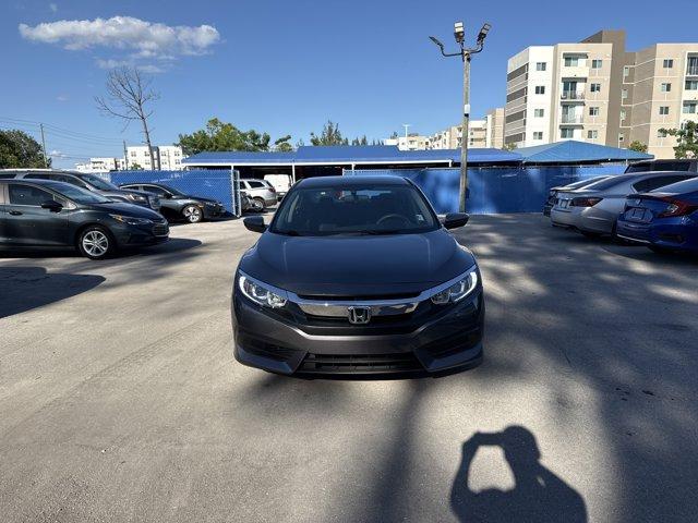 2017 Gray Honda Civic Sedan (19XFC2F56HE) with an 4 2.0 L engine, Variable transmission, located at 27610 S Dixie Hwy, Homestead, FL, 33032, (305) 749-2348, 25.510241, -80.438301 - IIHS Top Safety Pick. Boasts 40 Highway MPG and 31 City MPG! This Honda Civic Sedan delivers a Regular Unleaded I-4 2.0 L/122 engine powering this Variable transmission. Wheels: 16 w/Full Covers, VSA Electronic Stability Control (ESC), Valet Function.*This Honda Civic Sedan Comes Equipped with These - Photo#7