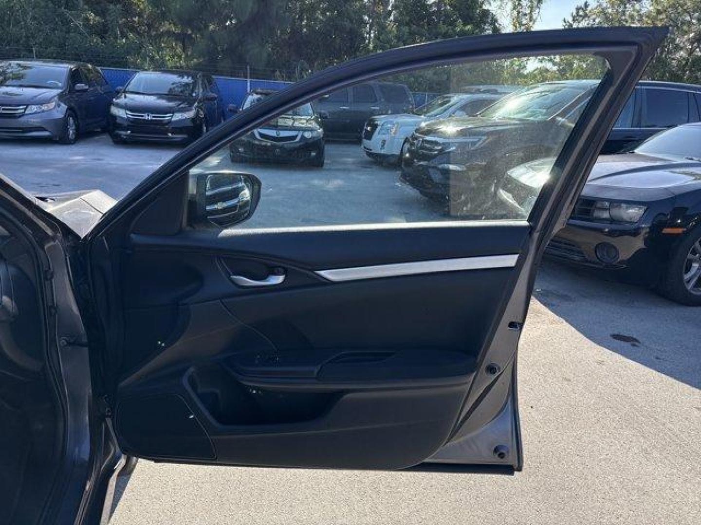 2017 Gray Honda Civic Sedan (19XFC2F56HE) with an 4 2.0 L engine, Variable transmission, located at 27610 S Dixie Hwy, Homestead, FL, 33032, (305) 749-2348, 25.510241, -80.438301 - IIHS Top Safety Pick. Boasts 40 Highway MPG and 31 City MPG! This Honda Civic Sedan delivers a Regular Unleaded I-4 2.0 L/122 engine powering this Variable transmission. Wheels: 16 w/Full Covers, VSA Electronic Stability Control (ESC), Valet Function.*This Honda Civic Sedan Comes Equipped with These - Photo#15