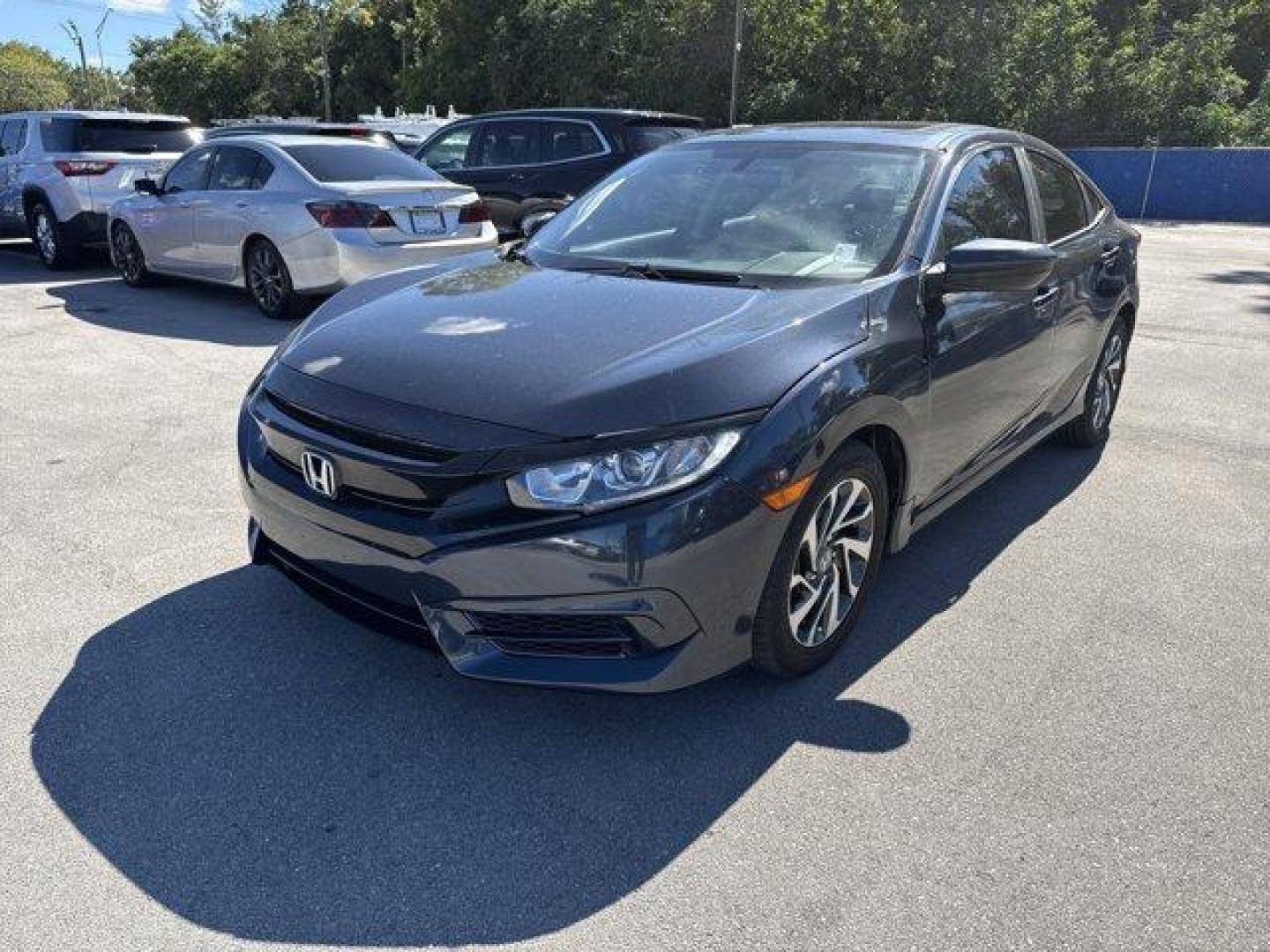 2016 Blue Honda Civic Sedan (19XFC2F70GE) with an 4 2.0 L engine, Variable transmission, located at 27610 S Dixie Hwy, Homestead, FL, 33032, (305) 749-2348, 25.510241, -80.438301 - IIHS Top Safety Pick+. Only 98,630 Miles! Scores 41 Highway MPG and 31 City MPG! This Honda Civic Sedan delivers a Regular Unleaded I-4 2.0 L/122 engine powering this Variable transmission. Window Grid Antenna, Wheels: 16 Alloy, Wheels w/Silver Accents.* This Honda Civic Sedan Features the Following - Photo#0