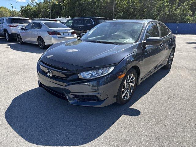 2016 Blue Honda Civic Sedan (19XFC2F70GE) with an 4 2.0 L engine, Variable transmission, located at 27610 S Dixie Hwy, Homestead, FL, 33032, (305) 749-2348, 25.510241, -80.438301 - IIHS Top Safety Pick+. Only 98,630 Miles! Scores 41 Highway MPG and 31 City MPG! This Honda Civic Sedan delivers a Regular Unleaded I-4 2.0 L/122 engine powering this Variable transmission. Window Grid Antenna, Wheels: 16 Alloy, Wheels w/Silver Accents.* This Honda Civic Sedan Features the Following - Photo#0
