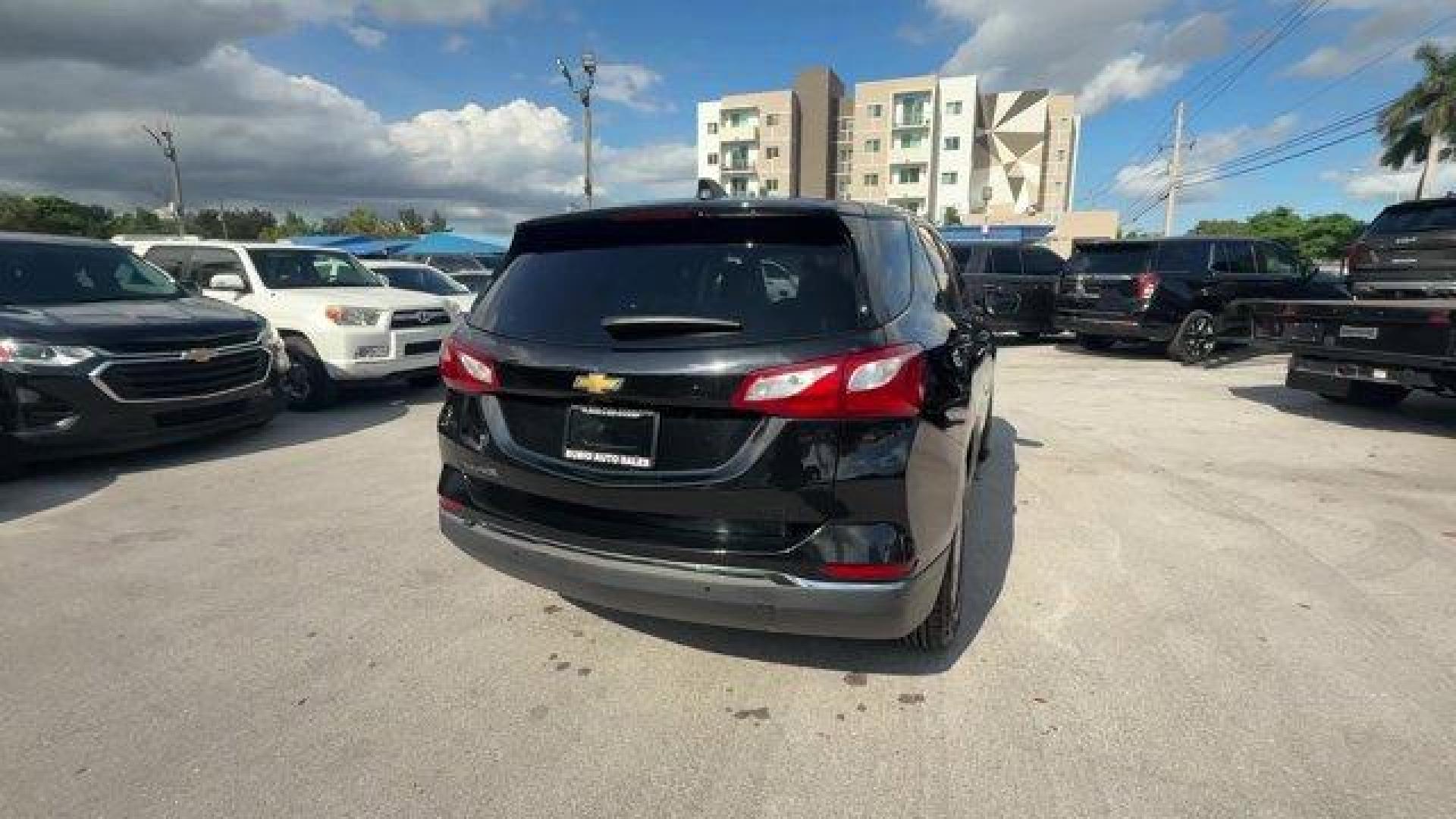 2021 Mosaic Black Metallic /Jet Black Chevrolet Equinox (2GNAXUEV1M6) with an 4 1.5L engine, Automatic transmission, located at 27610 S Dixie Hwy, Homestead, FL, 33032, (305) 749-2348, 25.510241, -80.438301 - IIHS Top Safety Pick with specific headlights. Boasts 30 Highway MPG and 25 City MPG! This Chevrolet Equinox boasts a Turbocharged Gas I4 1.5L/92 engine powering this Automatic transmission. WHEELS, 17 (43.2 CM) ALUMINUM (STD), UNIVERSAL HOME REMOTE includes garage door opener, programmable, TRANSMI - Photo#4