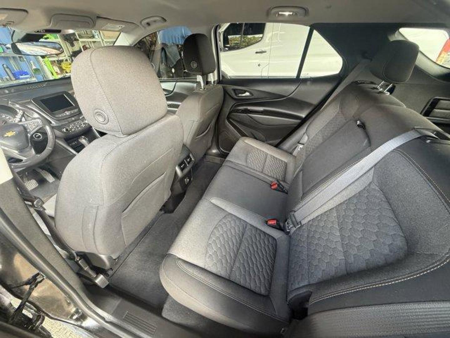 2021 Mosaic Black Metallic /Jet Black Chevrolet Equinox (2GNAXUEV1M6) with an 4 1.5L engine, Automatic transmission, located at 27610 S Dixie Hwy, Homestead, FL, 33032, (305) 749-2348, 25.510241, -80.438301 - IIHS Top Safety Pick with specific headlights. Boasts 30 Highway MPG and 25 City MPG! This Chevrolet Equinox boasts a Turbocharged Gas I4 1.5L/92 engine powering this Automatic transmission. WHEELS, 17 (43.2 CM) ALUMINUM (STD), UNIVERSAL HOME REMOTE includes garage door opener, programmable, TRANSMI - Photo#11