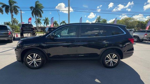2017 Black Honda Pilot (5FNYF5H80HB) with an 6 3.5 L engine, Automatic transmission, located at 27610 S Dixie Hwy, Homestead, FL, 33032, (305) 749-2348, 25.510241, -80.438301 - IIHS Top Safety Pick+. Delivers 27 Highway MPG and 19 City MPG! This Honda Pilot boasts a Regular Unleaded V-6 3.5 L/212 engine powering this Automatic transmission. Window Grid Antenna, Wheels: 18 Alloy, Wheels w/Machined Accents.*This Honda Pilot Comes Equipped with These Options *VSA Electronic S - Photo#1