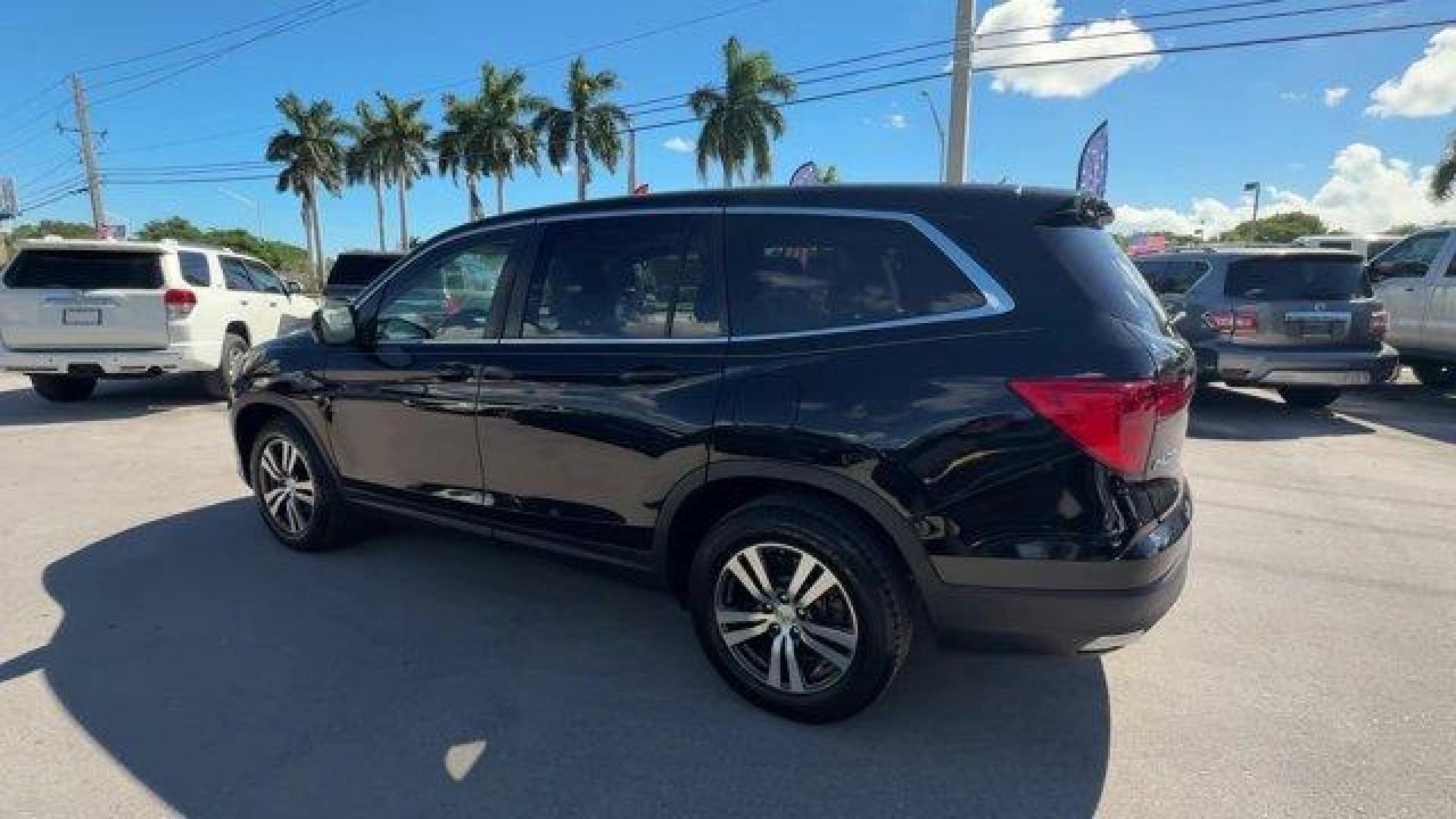 2017 Black Honda Pilot (5FNYF5H80HB) with an 6 3.5 L engine, Automatic transmission, located at 27610 S Dixie Hwy, Homestead, FL, 33032, (305) 749-2348, 25.510241, -80.438301 - IIHS Top Safety Pick+. Delivers 27 Highway MPG and 19 City MPG! This Honda Pilot boasts a Regular Unleaded V-6 3.5 L/212 engine powering this Automatic transmission. Window Grid Antenna, Wheels: 18 Alloy, Wheels w/Machined Accents.*This Honda Pilot Comes Equipped with These Options *VSA Electronic S - Photo#2