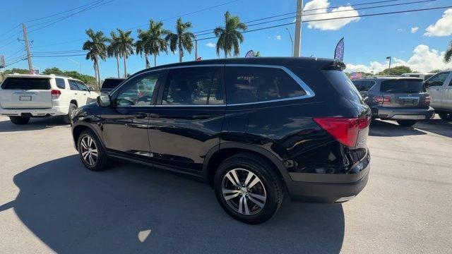 2017 Black Honda Pilot (5FNYF5H80HB) with an 6 3.5 L engine, Automatic transmission, located at 27610 S Dixie Hwy, Homestead, FL, 33032, (305) 749-2348, 25.510241, -80.438301 - IIHS Top Safety Pick+. Delivers 27 Highway MPG and 19 City MPG! This Honda Pilot boasts a Regular Unleaded V-6 3.5 L/212 engine powering this Automatic transmission. Window Grid Antenna, Wheels: 18 Alloy, Wheels w/Machined Accents.*This Honda Pilot Comes Equipped with These Options *VSA Electronic S - Photo#2