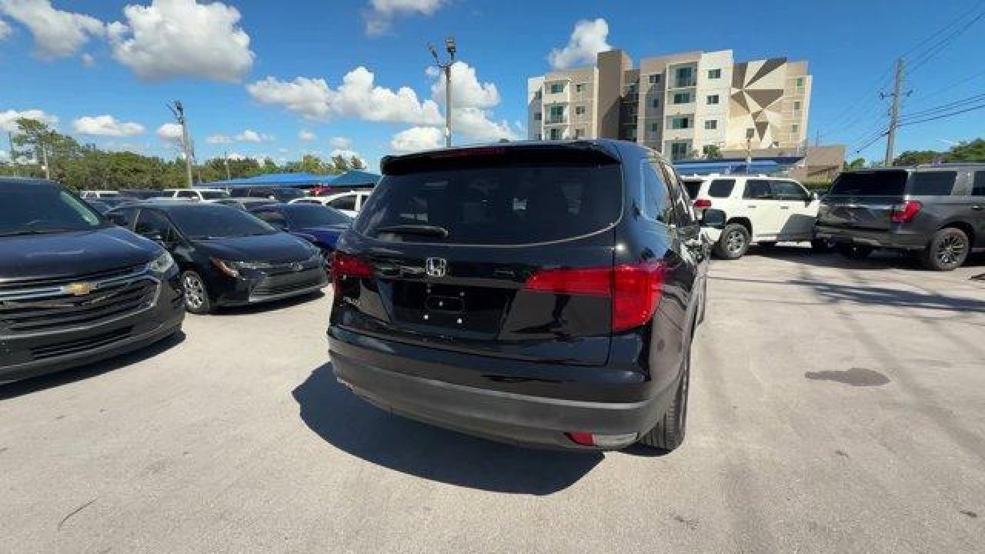 2017 Black Honda Pilot (5FNYF5H80HB) with an 6 3.5 L engine, Automatic transmission, located at 27610 S Dixie Hwy, Homestead, FL, 33032, (305) 749-2348, 25.510241, -80.438301 - IIHS Top Safety Pick+. Delivers 27 Highway MPG and 19 City MPG! This Honda Pilot boasts a Regular Unleaded V-6 3.5 L/212 engine powering this Automatic transmission. Window Grid Antenna, Wheels: 18 Alloy, Wheels w/Machined Accents.*This Honda Pilot Comes Equipped with These Options *VSA Electronic S - Photo#4